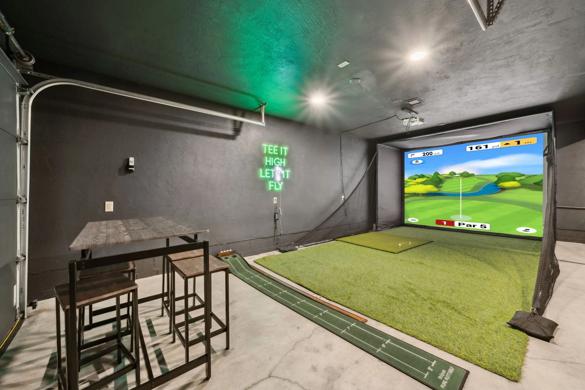 black fern cabin large game room with golf simulator