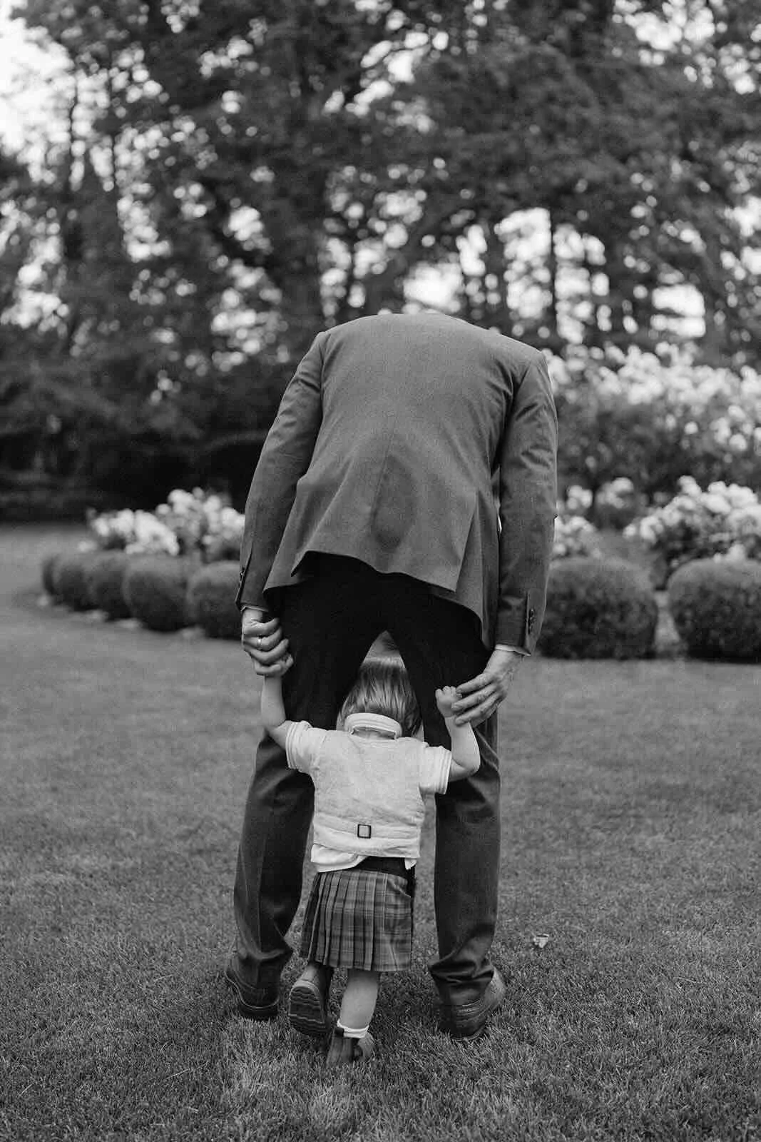 An older man guiding a young boy at a Bowral wedding