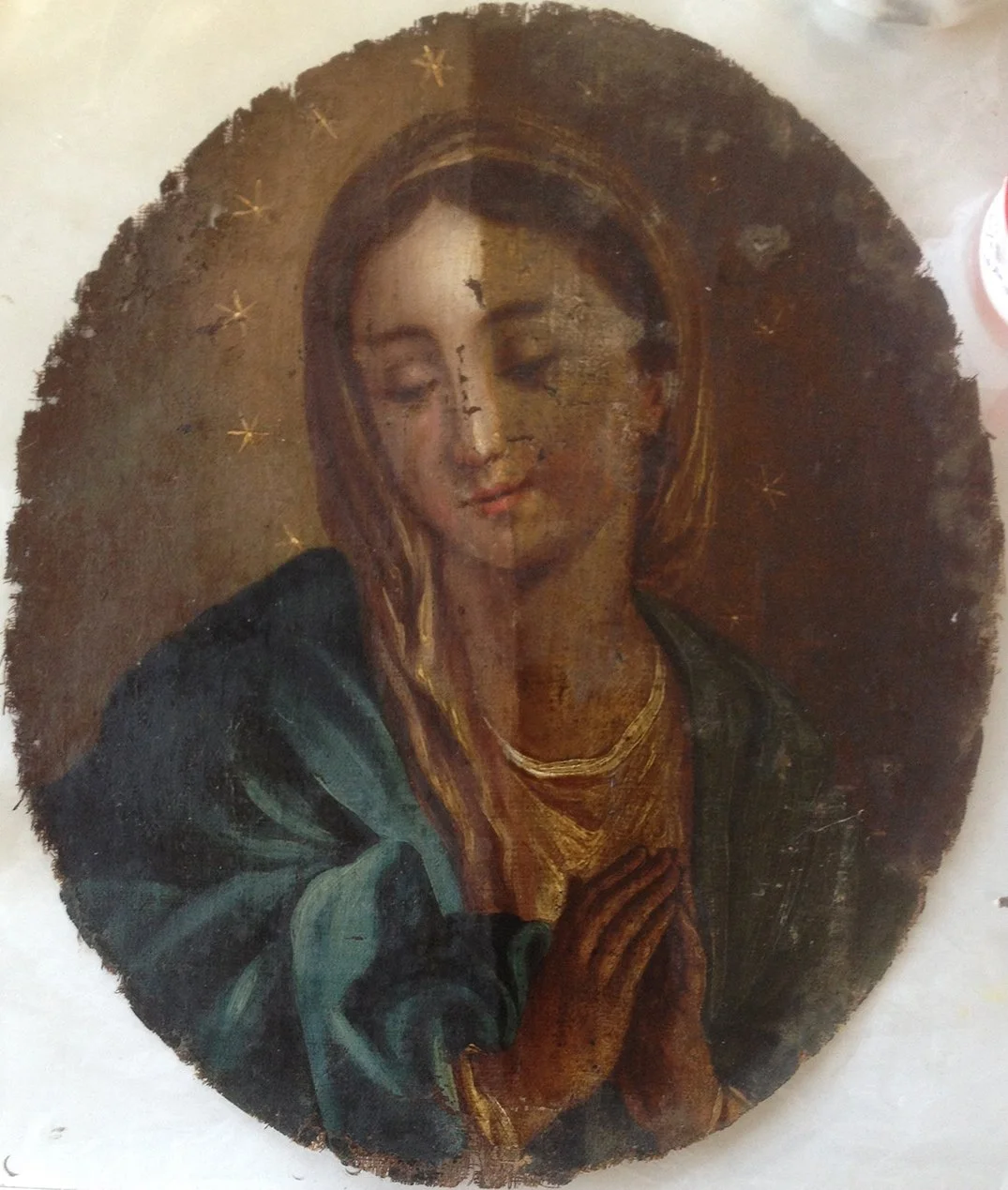 After removing the old vernish from half of the painting.