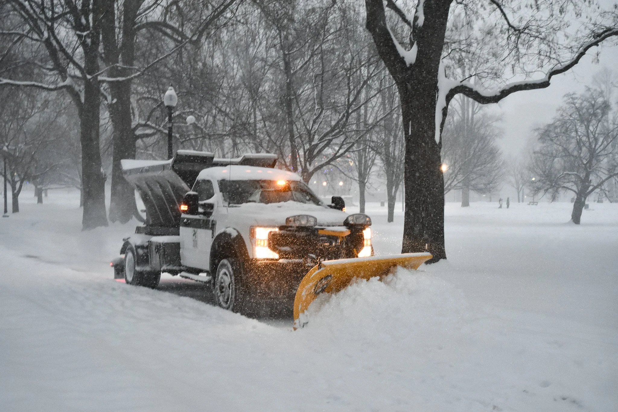 Boston, MA: Jan. 25 -  A snow plow pushes snow off one of the main walkways in the Boston Common. 
