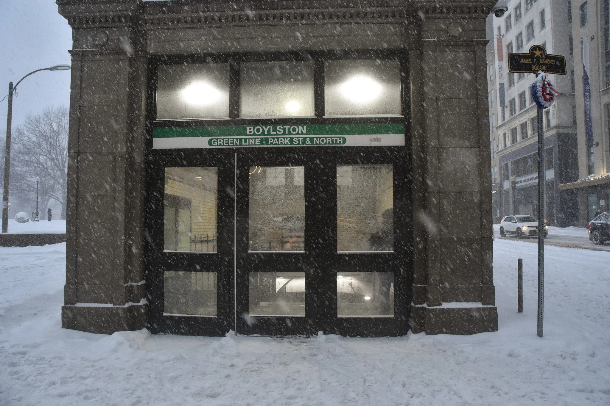 Boston, MA: Jan. 25 - A person waits inside the entry of the Boylston Street T station. 