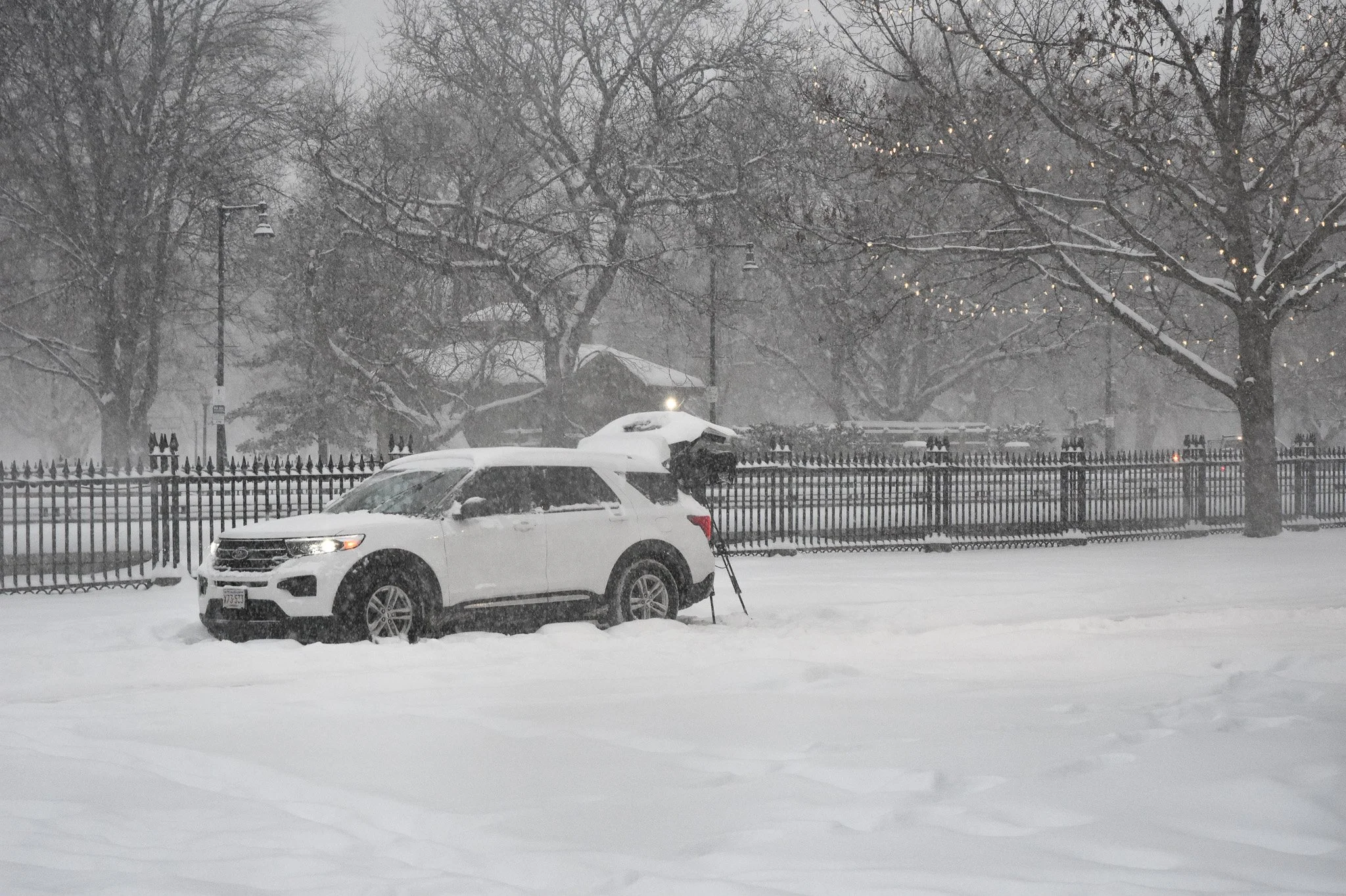 Boston, MA: Jan. 25 -  A news crew vehicle with its trunk open to protect the camera equipment. 