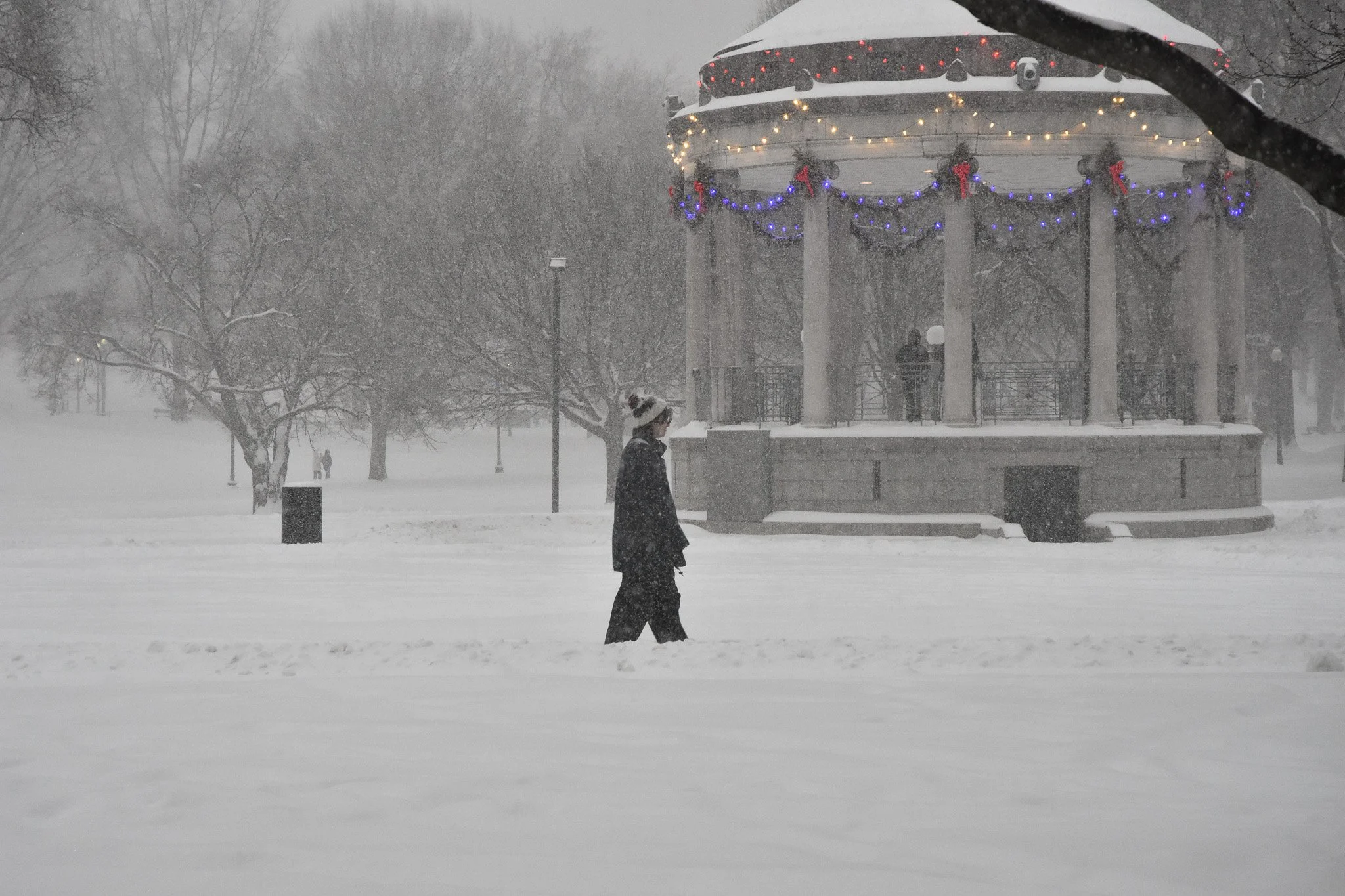 Boston, MA: Jan. 25 -  A person walks in the snow around the Boston Common Gazebo. 