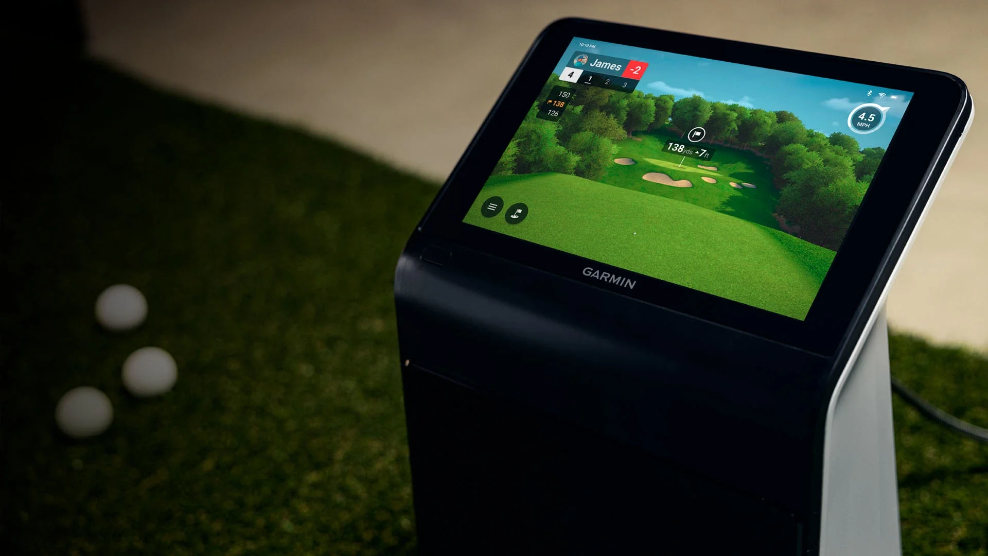 Garmin Approach R50 golf launch monitor as part of a portable golf simulator rental setup.