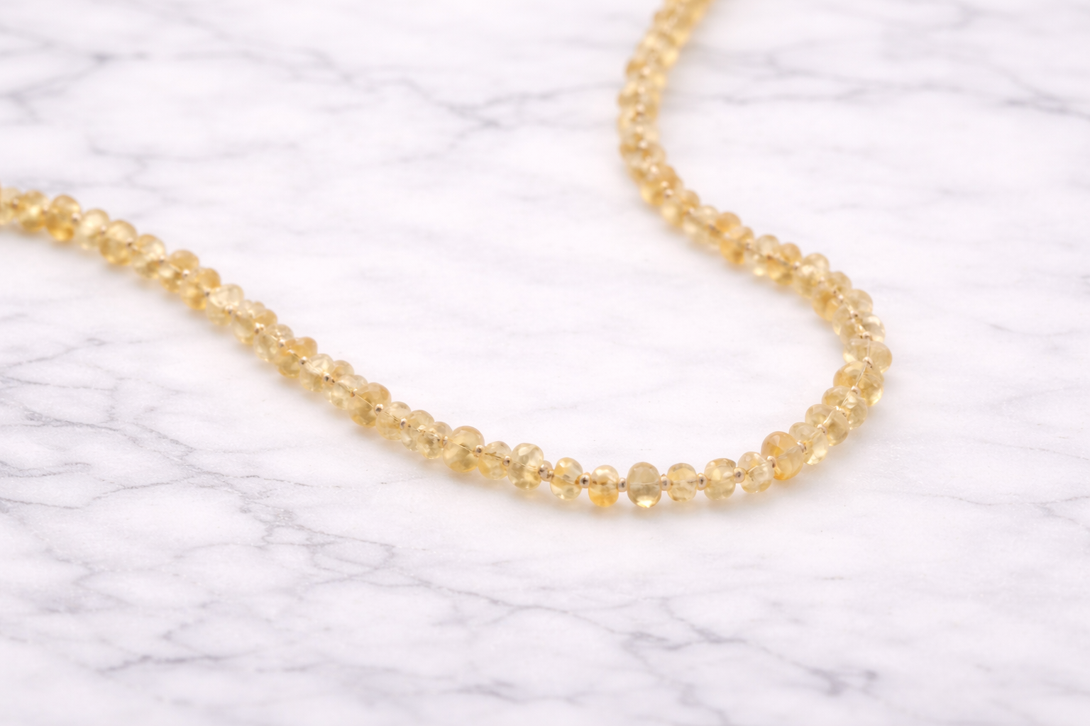 Golden citrine on marble background.png