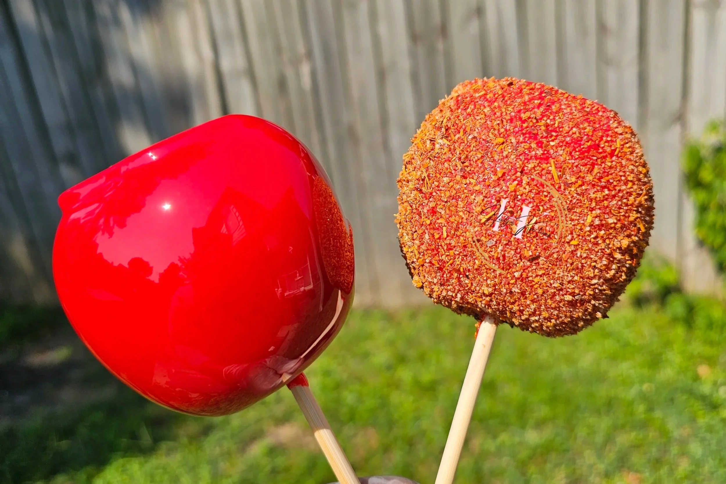 Four customized cans with floral and designer patterns featuring the names Martha, Quittia, Kierra, and Shamoya.