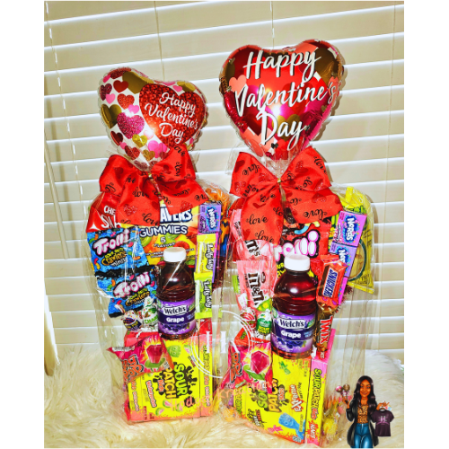 Decorative porch post with a black and brown leopard print pattern, a central black section with white text 'Home Sweet Home' inside a white leaf wreath, topped with a large silver bow and greenery, on a porch with potted plants and a tree in the background.