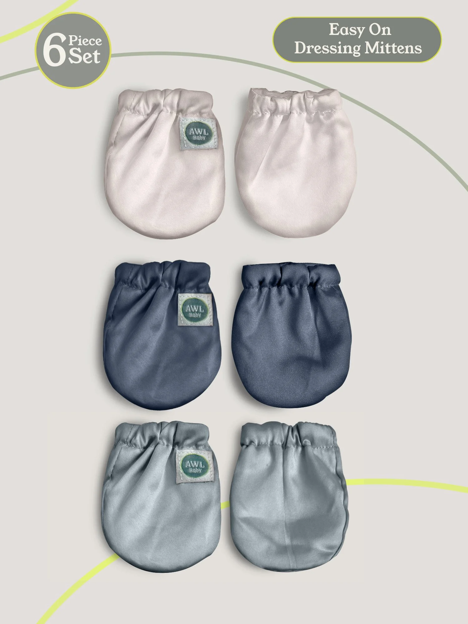 Six-piece set of baby dressing mittens in cream and navy colors arranged in pairs.