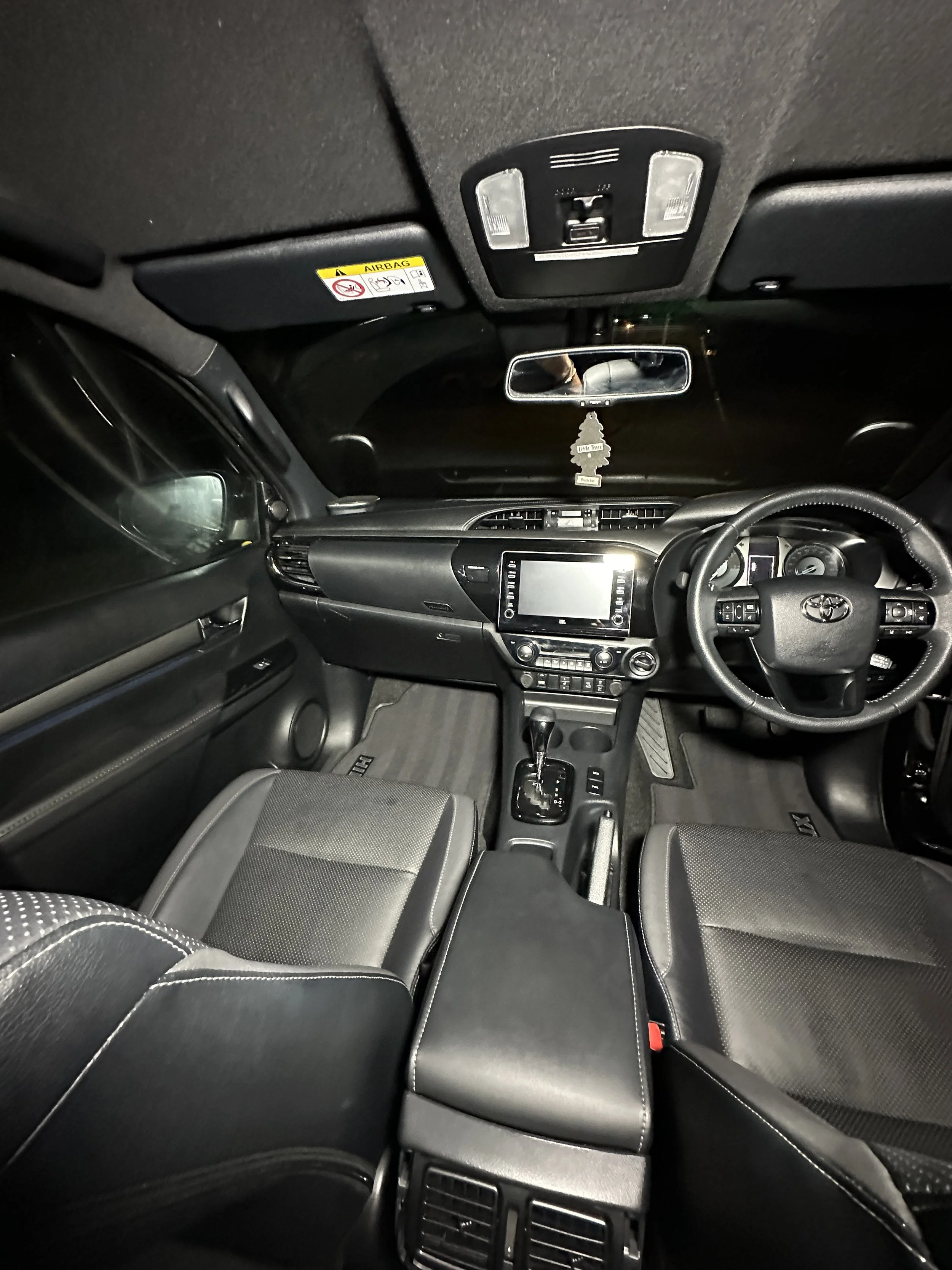 A Toyota interior restored to a pristine condition after Steam & Gleam's detailing service, showcasing a spotless dashboard, seats, and console.
