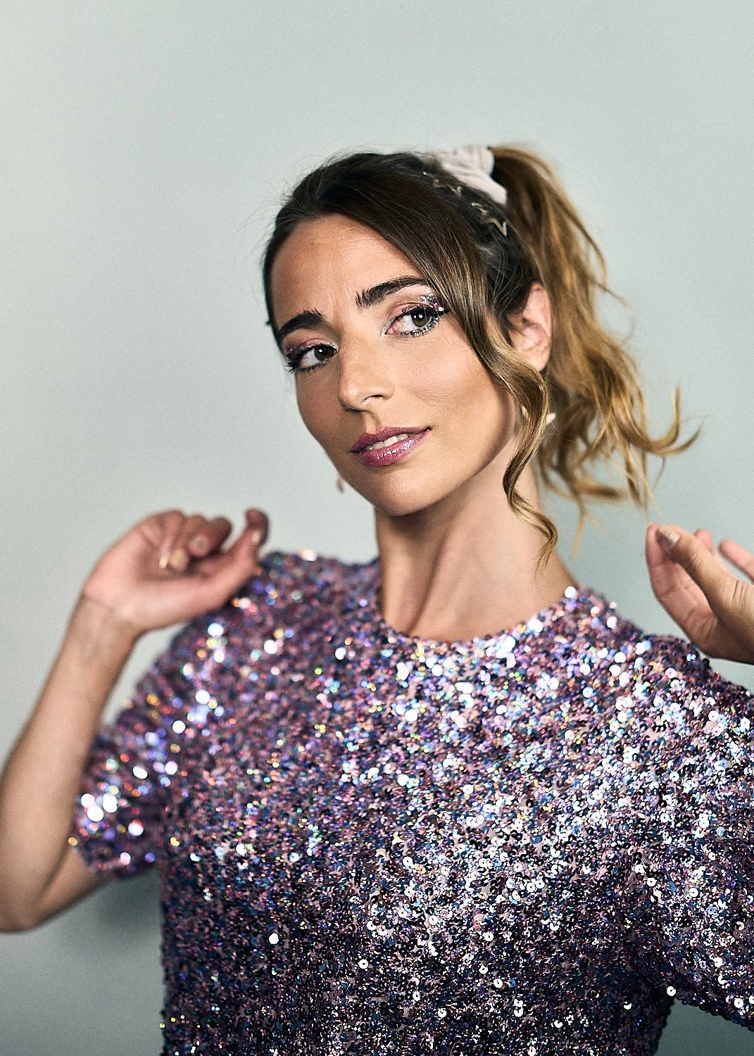 Actress wearing sequin top dancing, gift cards photograph