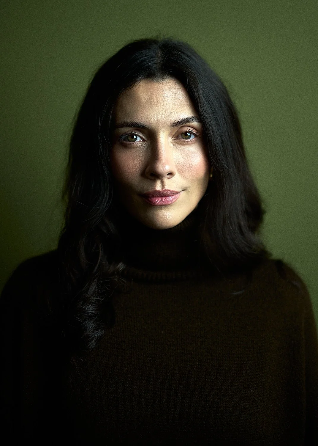 Tani with dark hair, business headshot