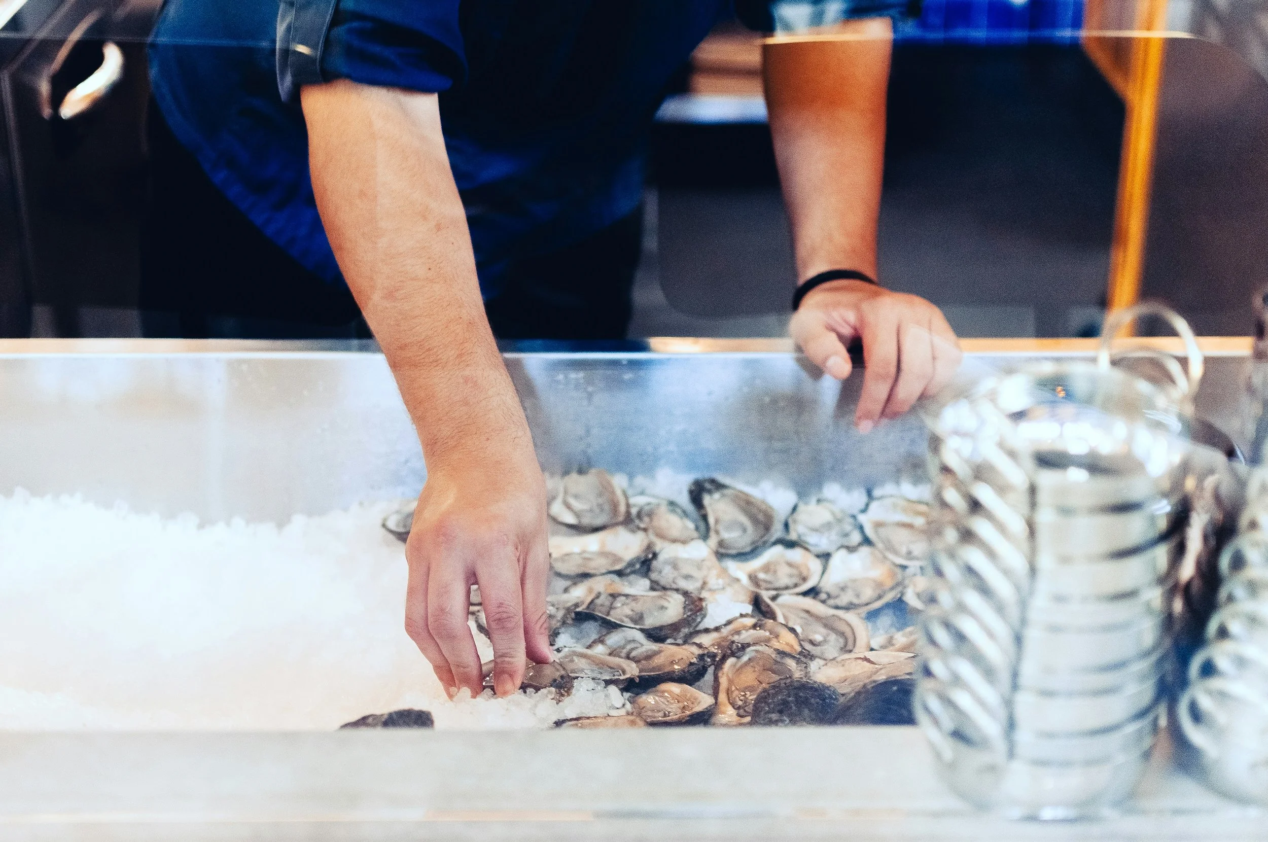 A MAN ORGANIZNG OYSTERS