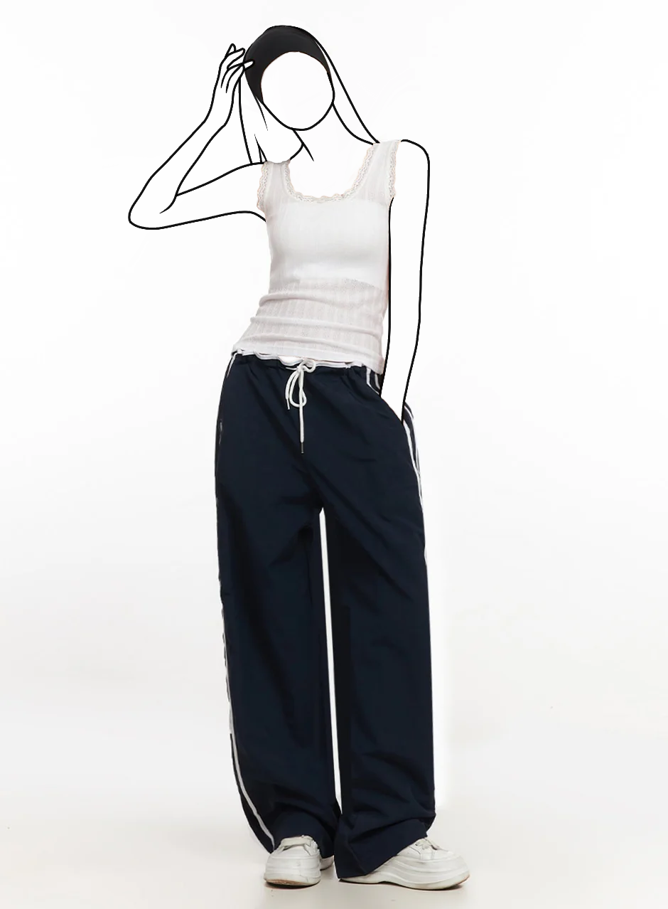 Pruhované teplákové nohavice z nylonu