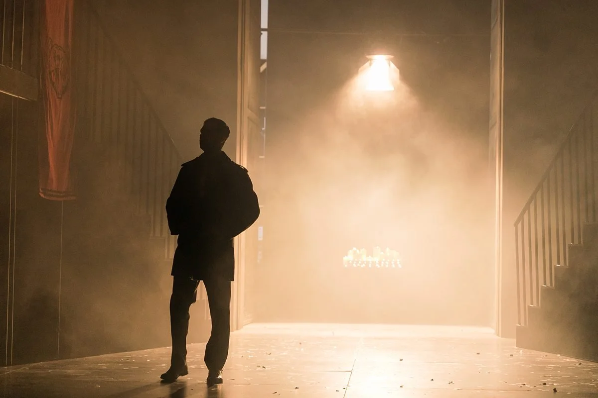 Live music performance in a venue with audience, celebrating 10 year anniversary, stage lights and guitars visible.
