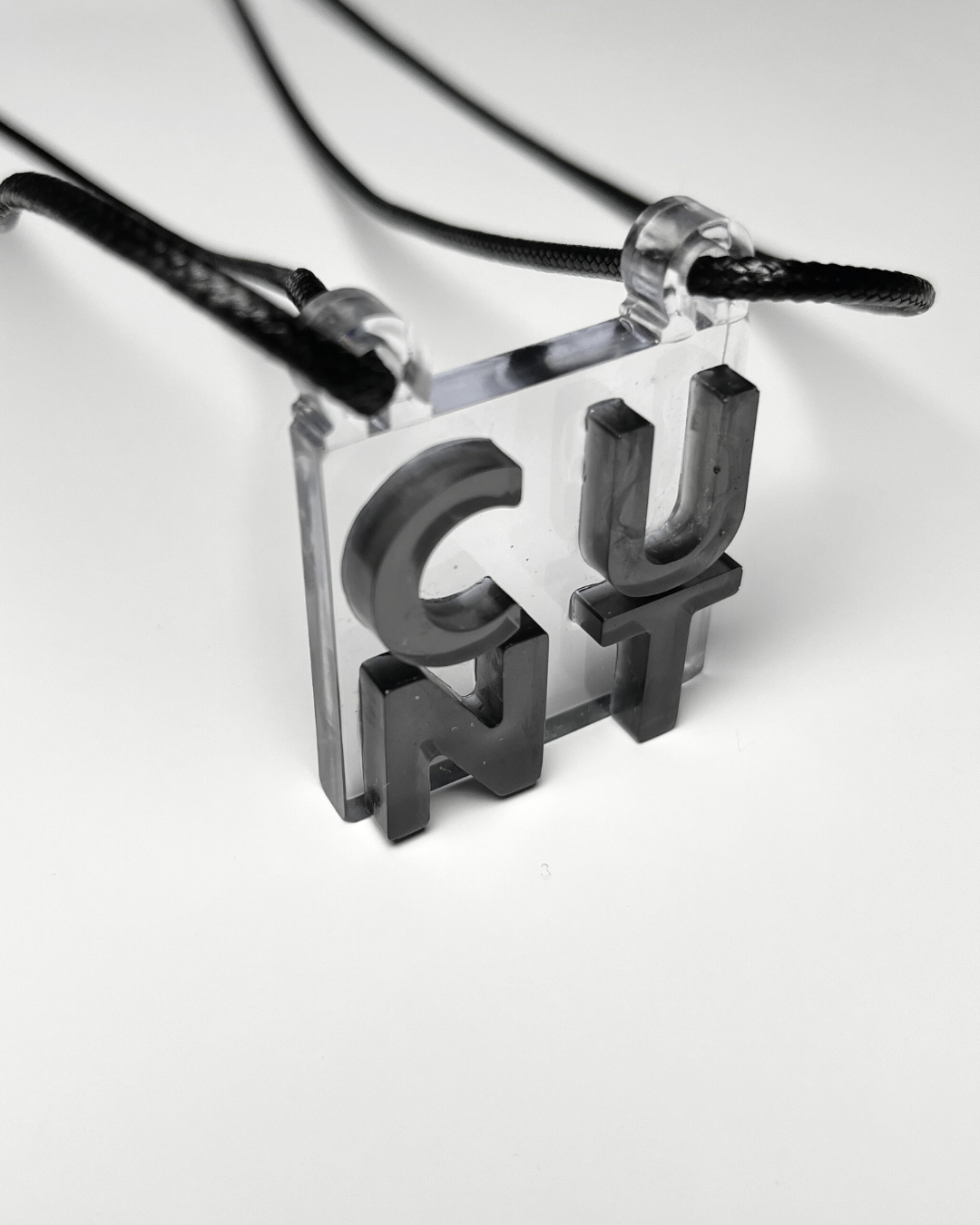 cunt necklace in transparent, clear color; statement, rude, bold pendant; обидно, пънк, прозрачно колие.