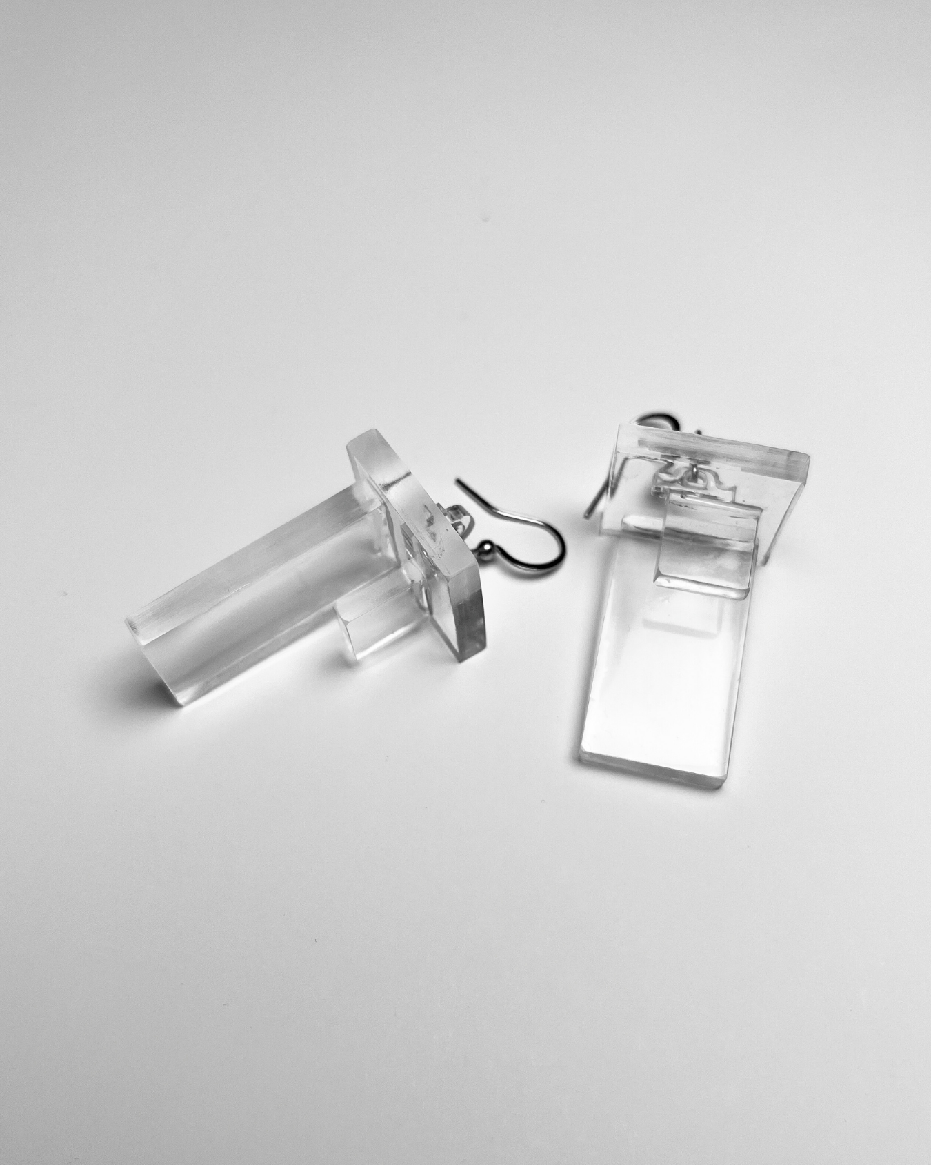 geometric, architectural, clear, transparent, statement dangle earrings. bold contemporary jewellery.