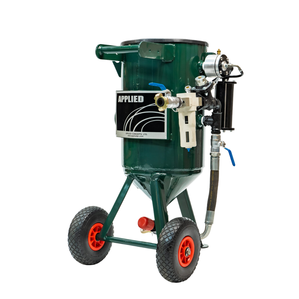 A green mobile sprayer with black and white label, red wheels, black and blue hoses, metal and plastic connectors.