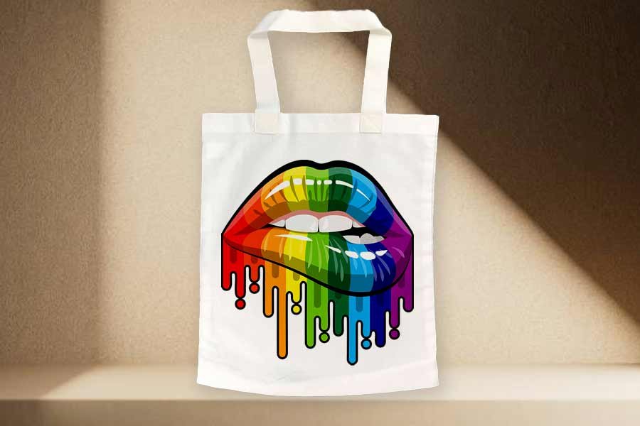 "Rainbow Lips" Tote Bag featuring vibrant, bold lips graphic design, spacious interior, and reinforced handles.