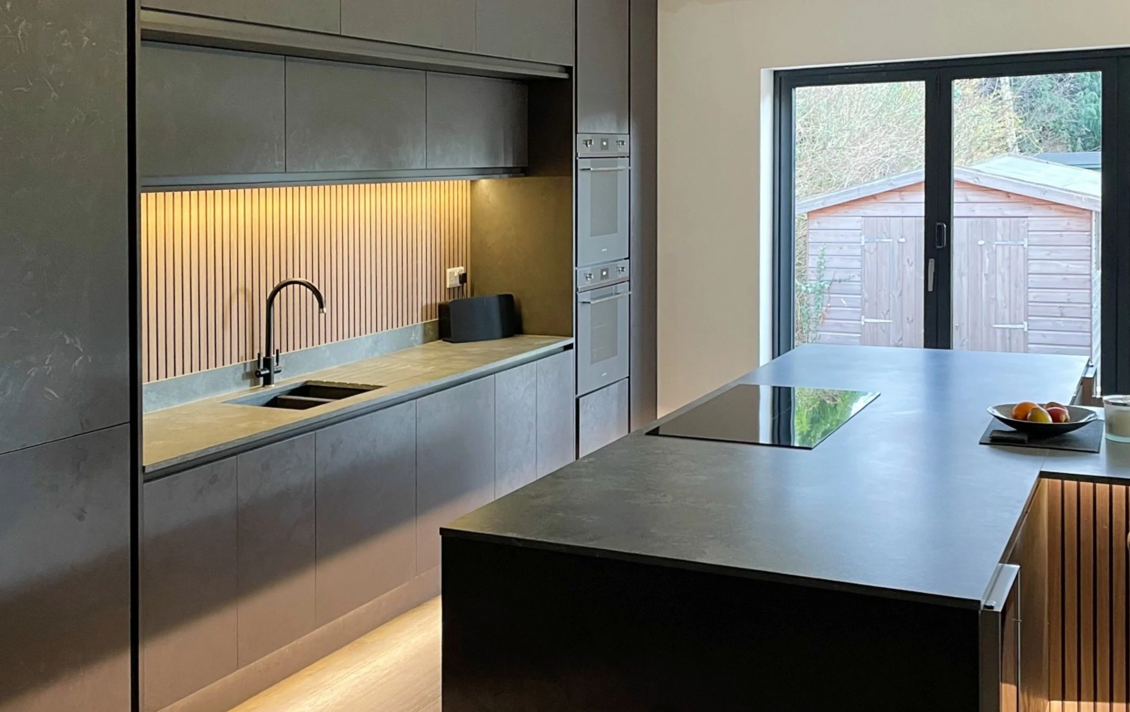 modern handleless black kitchen
