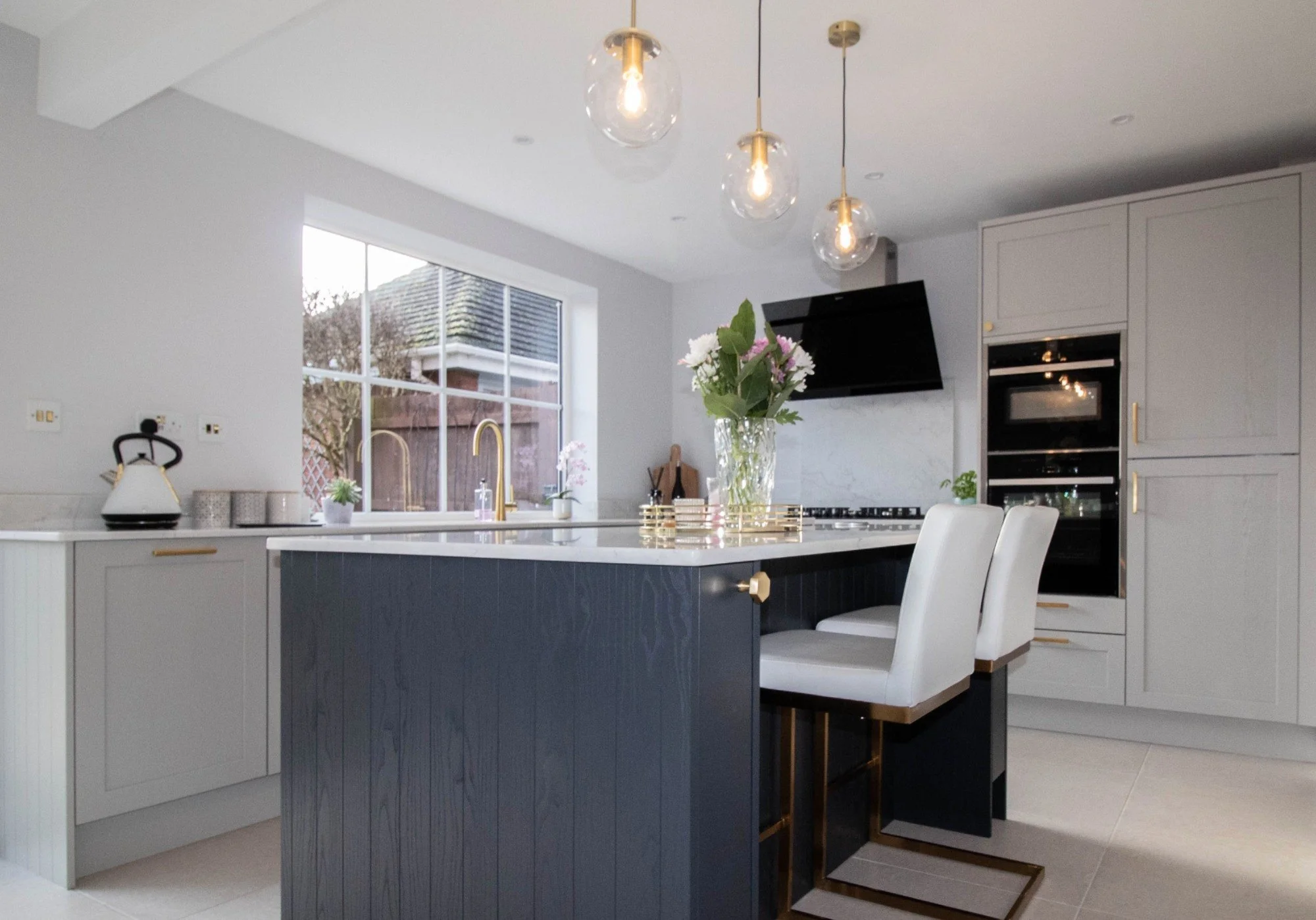 white quartz worktop in a shaker kitchen