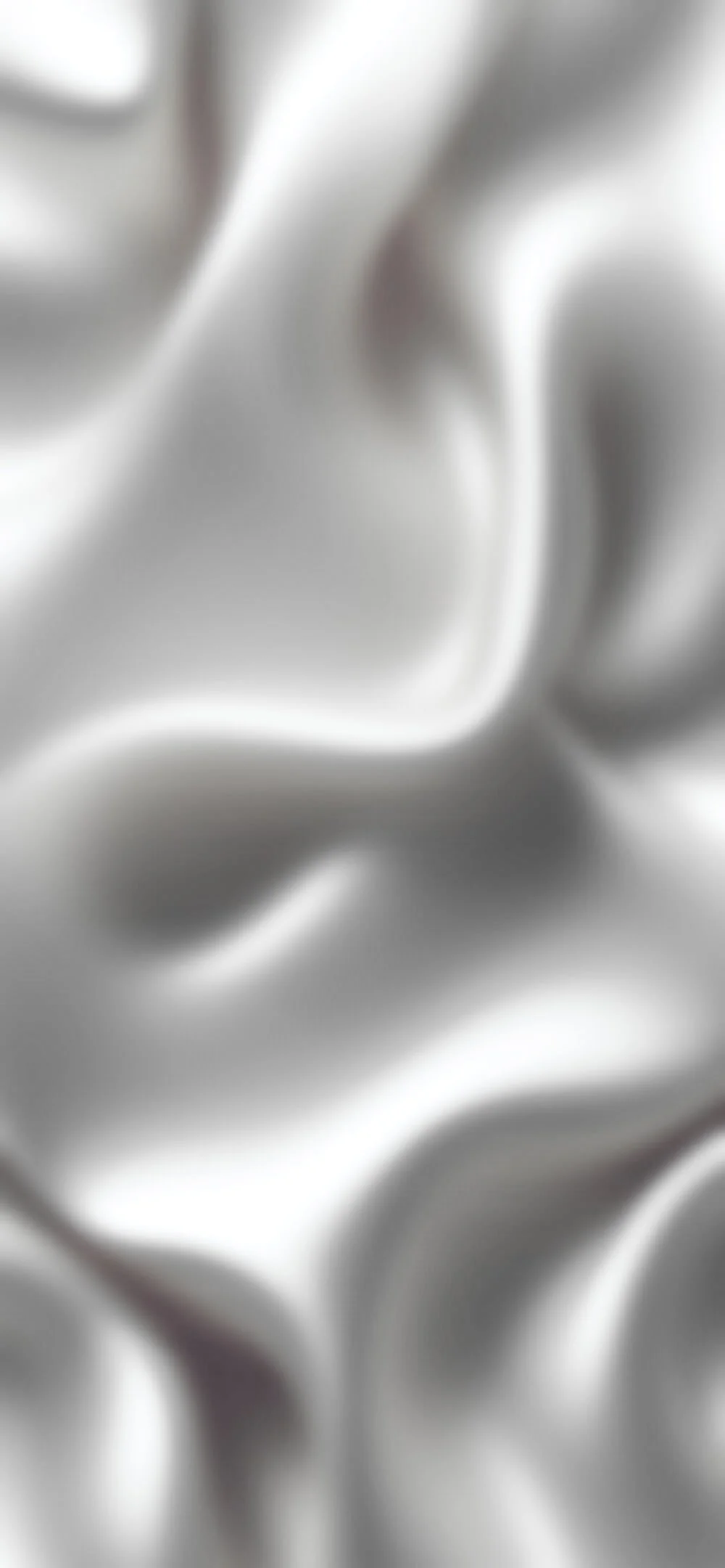 Close-up of a crumpled metallic surface with shiny and reflective textures.