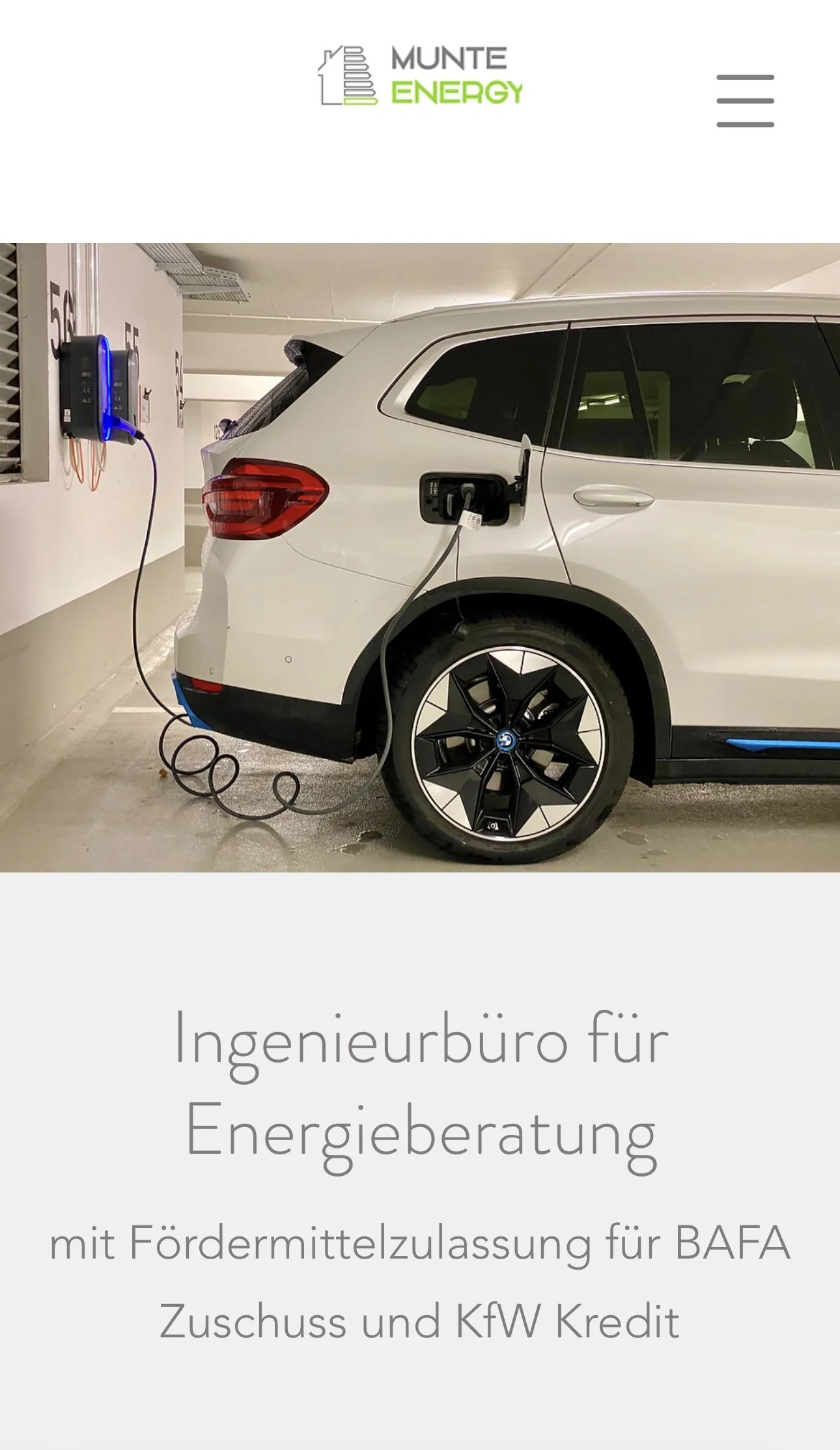 An electric BMW SUV plugged into a charging station in an underground parking garage with the logo of Munte Energy and German text about energy consulting and funding for electric vehicles.