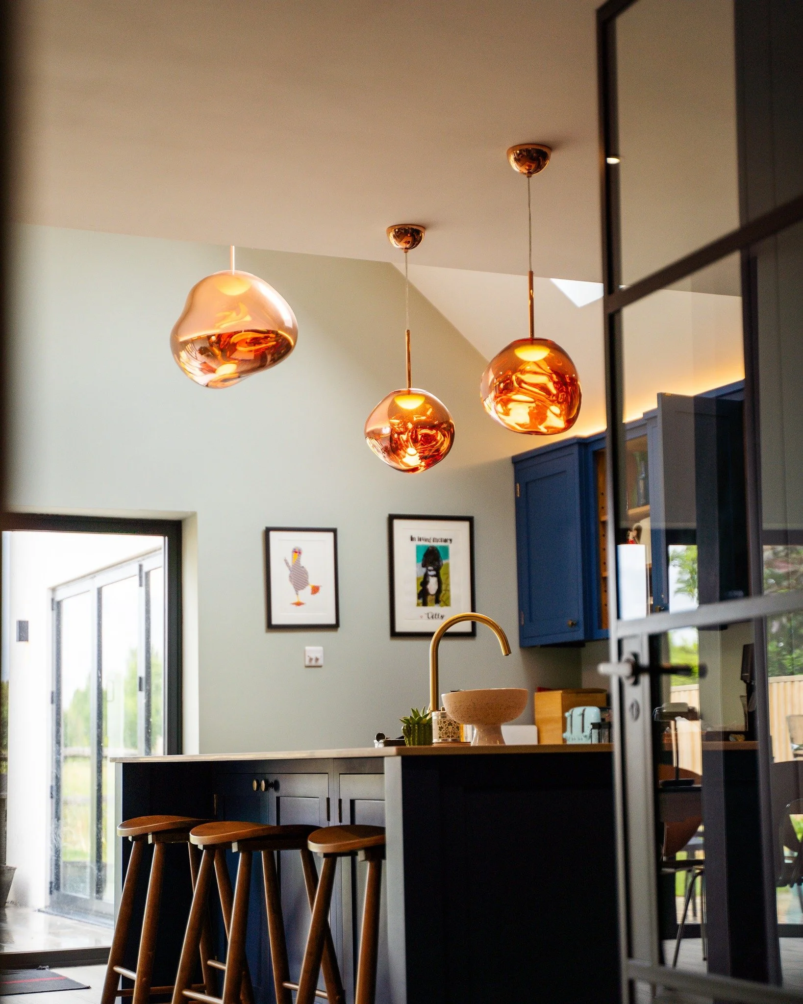 We recently installed these striking Tom Dixon pendants in a beautifully designed kitchen space. Each one is hand-blown, with a sculptural form and warm copper finish that makes a real statement above the island.

To complement the look, we added a d