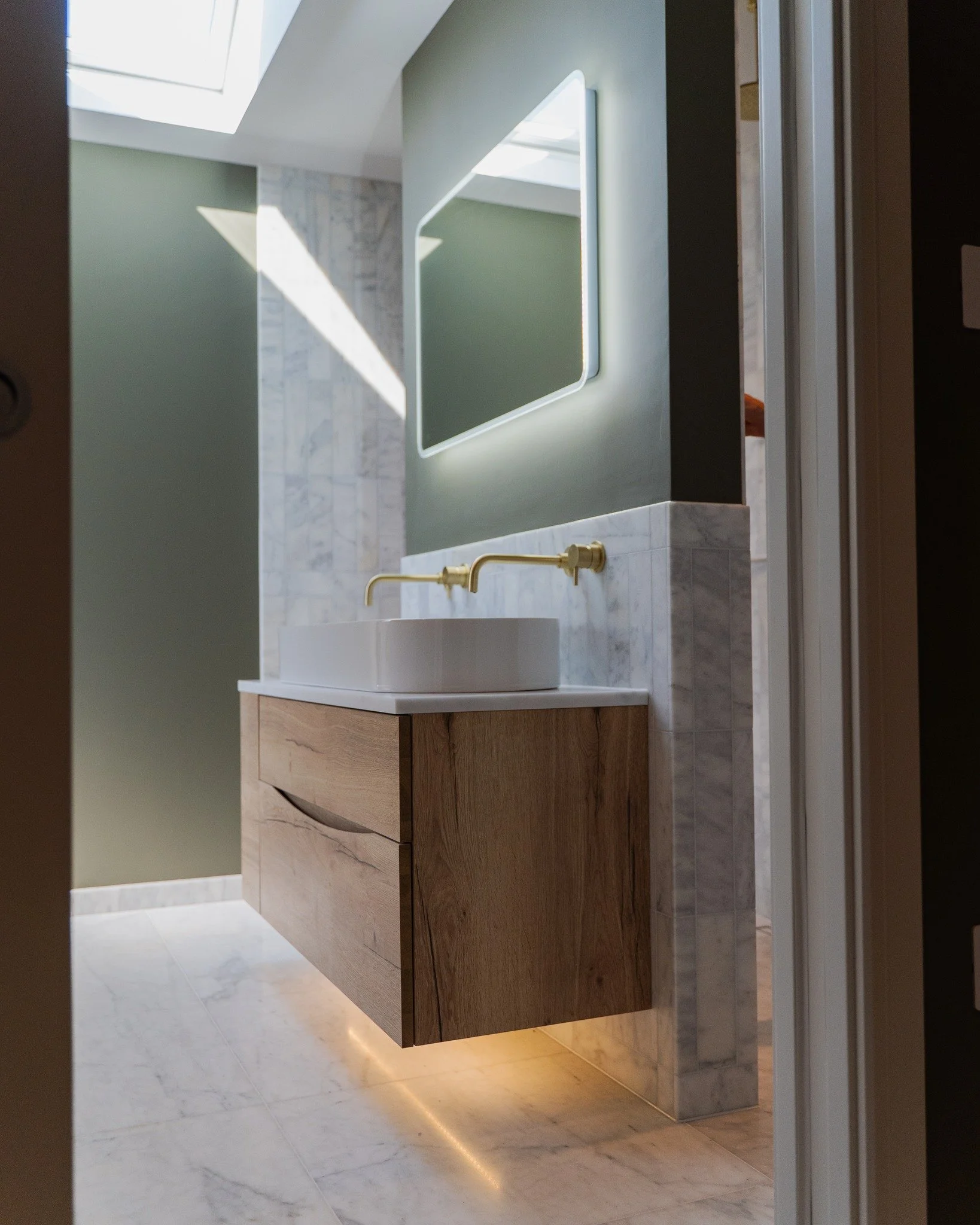 A few from our recent installations &mdash; each bathroom with its own character, but all with lighting that feels just right. From subtle under-cabinet glows to statement wall lights and mirrors, we worked with each client to help choose and install