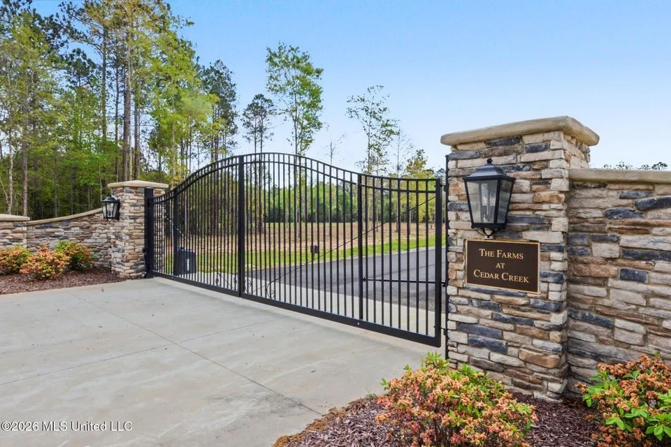 farms at cedar creek gate front entrance with lots of five plus acres located in george county ms