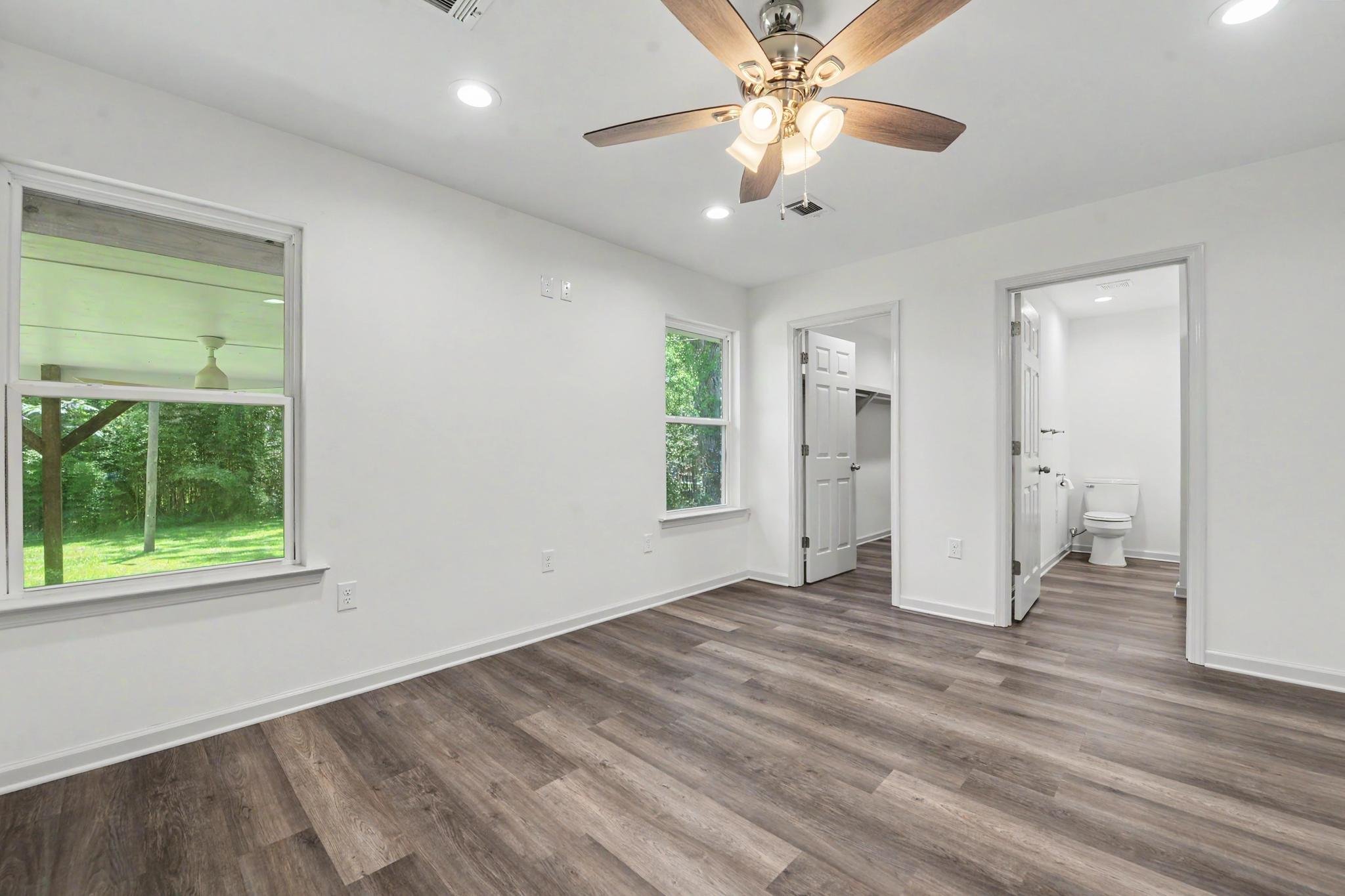 3 bedroom 2 bathroom house located in the city limits of lucedale olive green house  with green front yard brown shutters located in george county mississippi