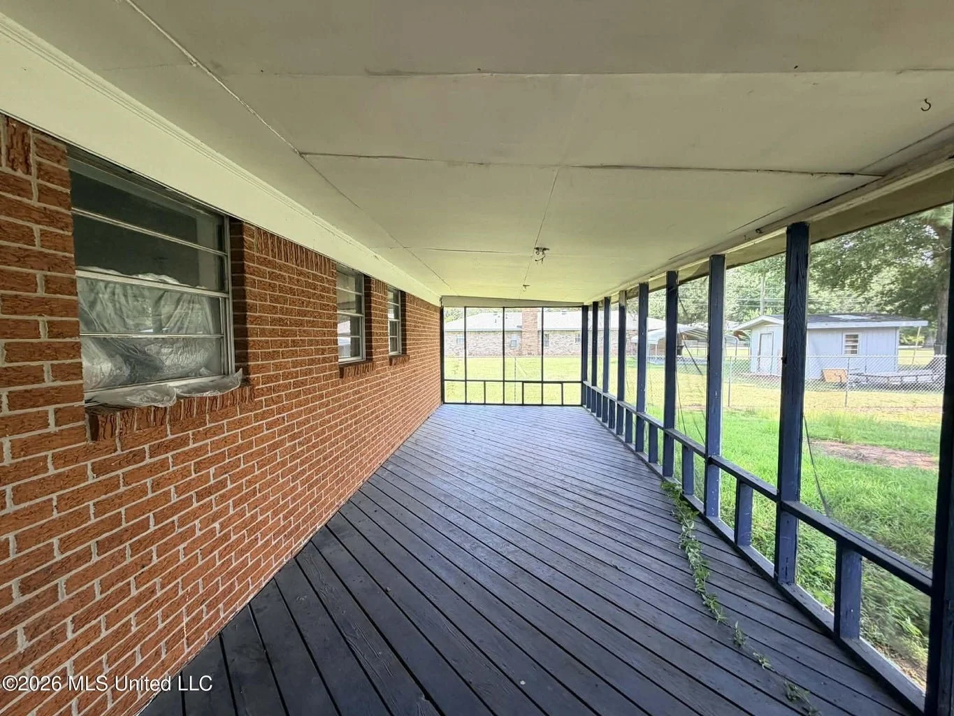 brick home inside lucedale city limits with 3 bedrooms three bedrooms and 2 bathrooms two bathrooms and a brick fireplace with a nice back porch