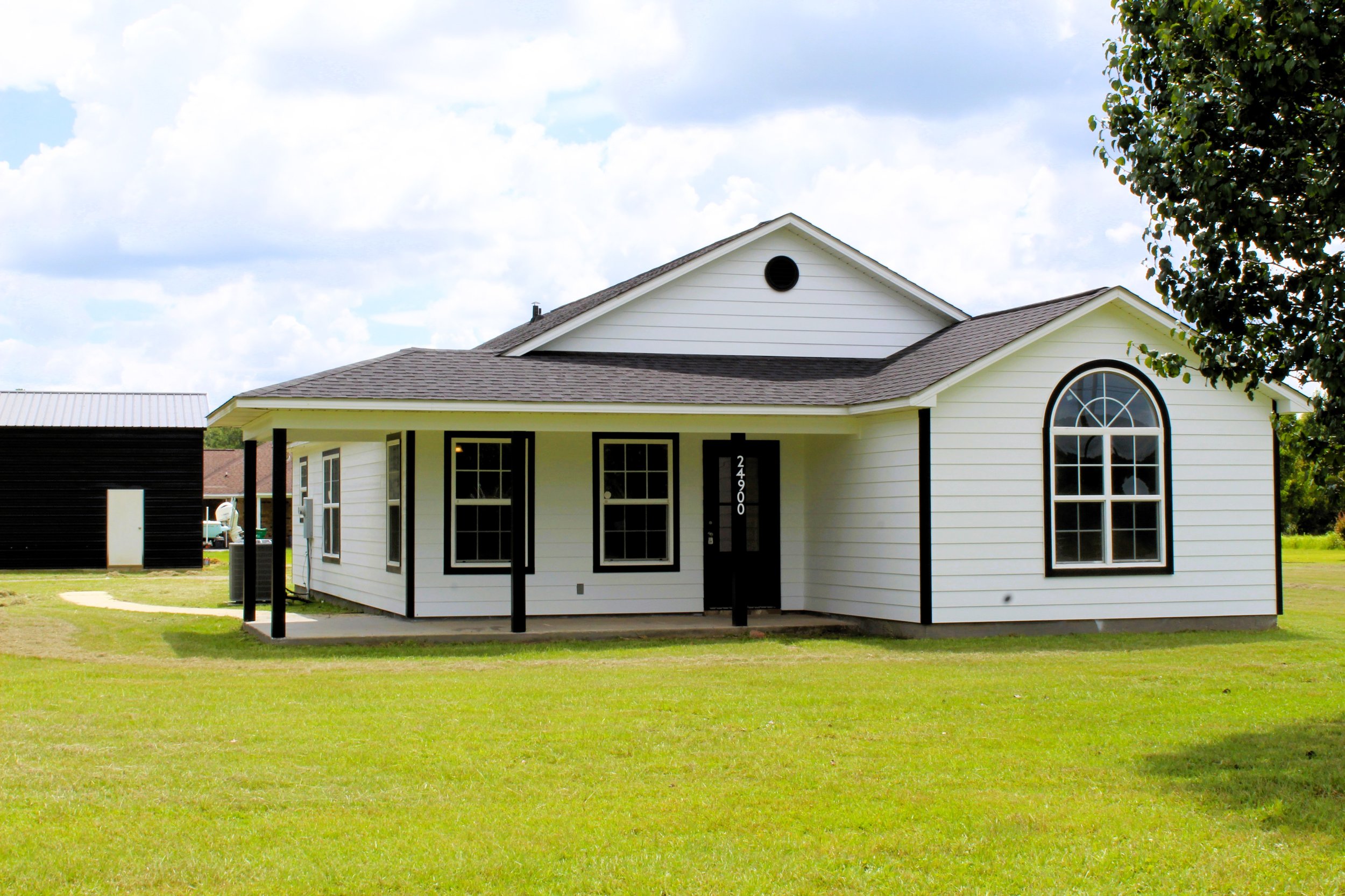 beautifully remodeled white and black home in the east central school district with 4 bedrooms four bedrooms and 3 bathrooms three bathrooms with a large 30x40 30 by 40 workshop on property with 1 acre