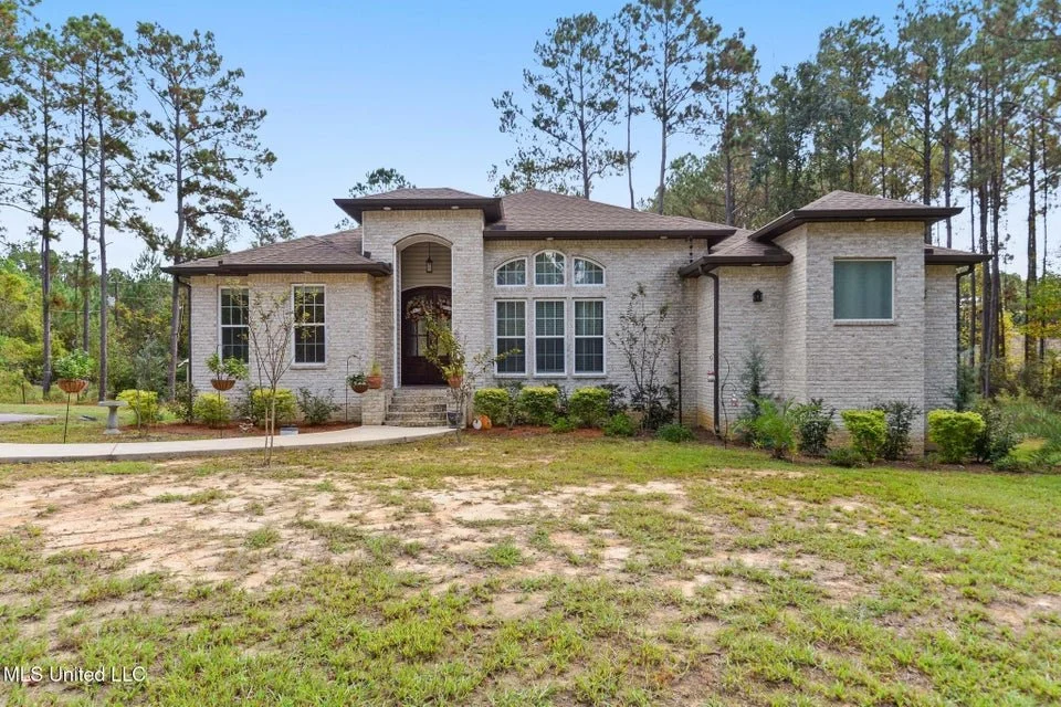 3 bedroom 2 bathroom brick home located in lucedale mississippi george county mississippi with a wood burning fireplace and has 1 acre
