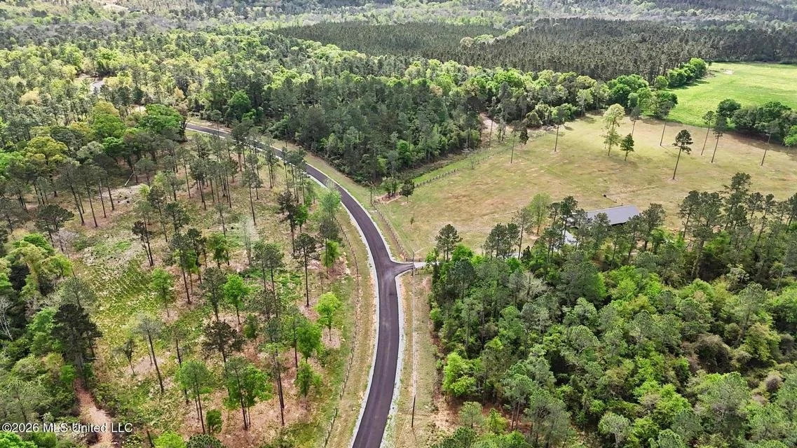 farms at cedar creek gate front entrance with lots of five plus acres located in george county ms