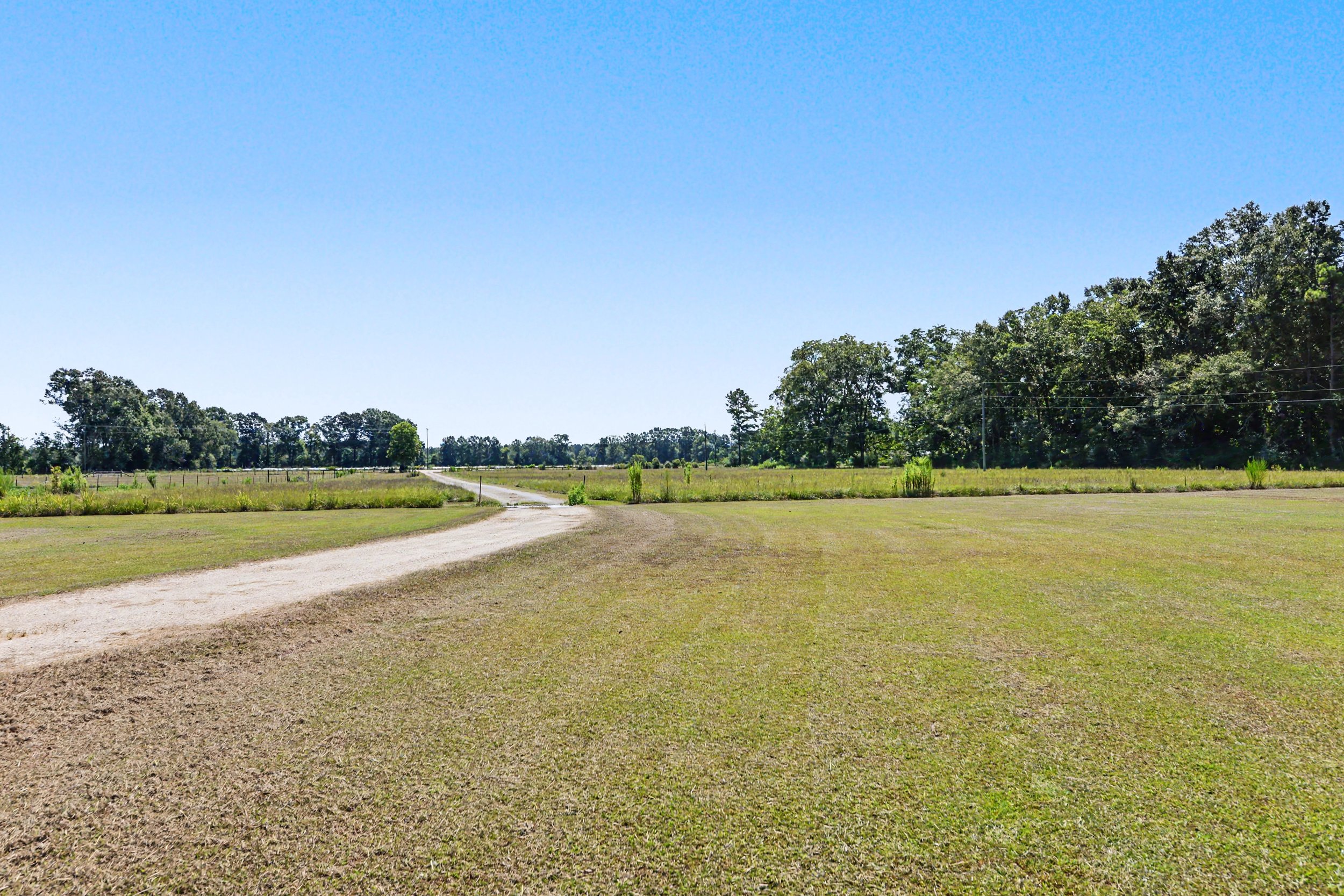 beautiful cedar and brick home with 2000 square feet and 3 bedrooms three bedrooms and 2 bathrooms two bathrooms and has five acres 5 acres with a workshop shed located on property and brick floors though out