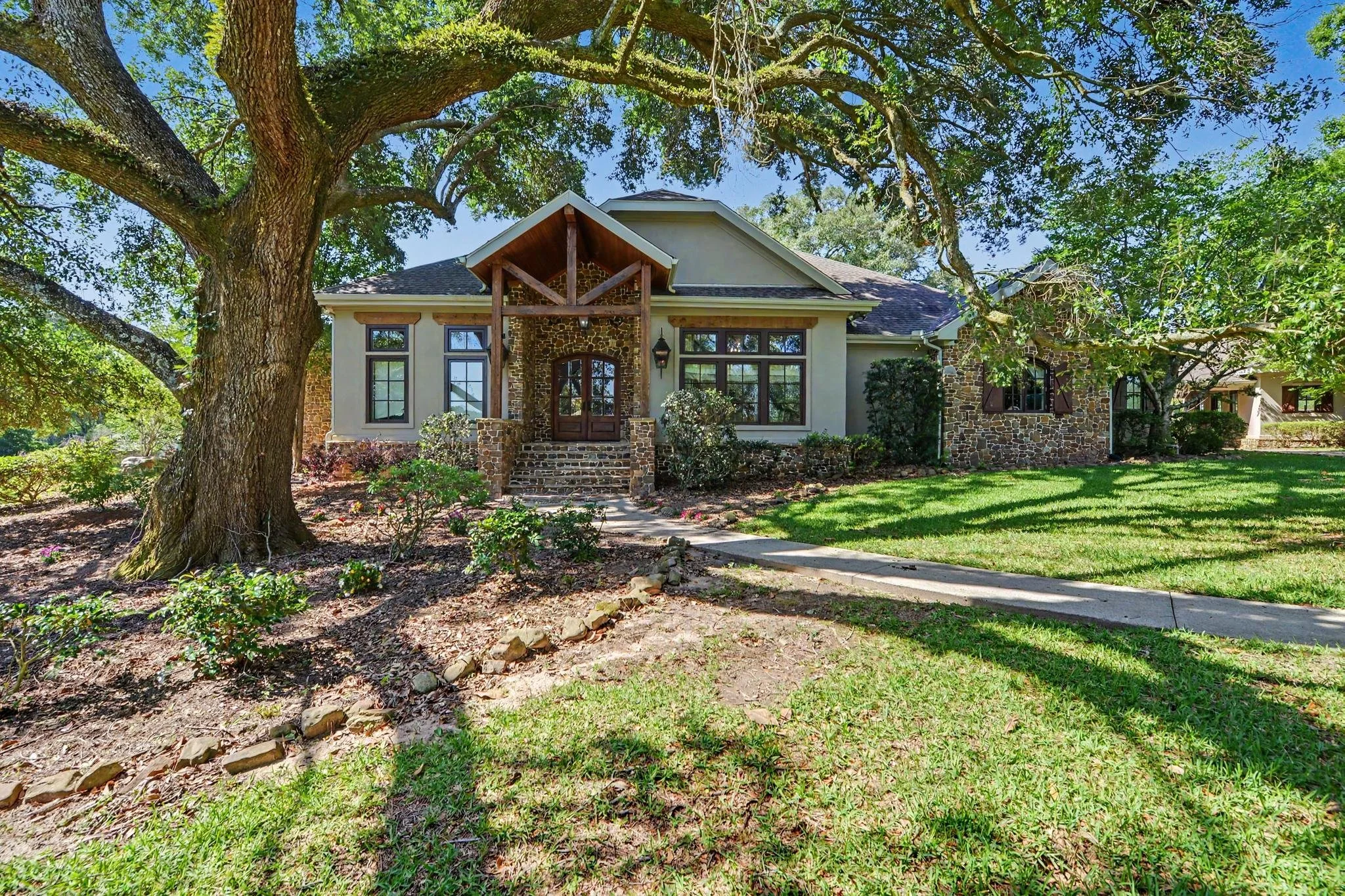 large home with 20 acres stone siding and walkway with guest house and gunite salt water pool located in agricola mississippi in george county ms