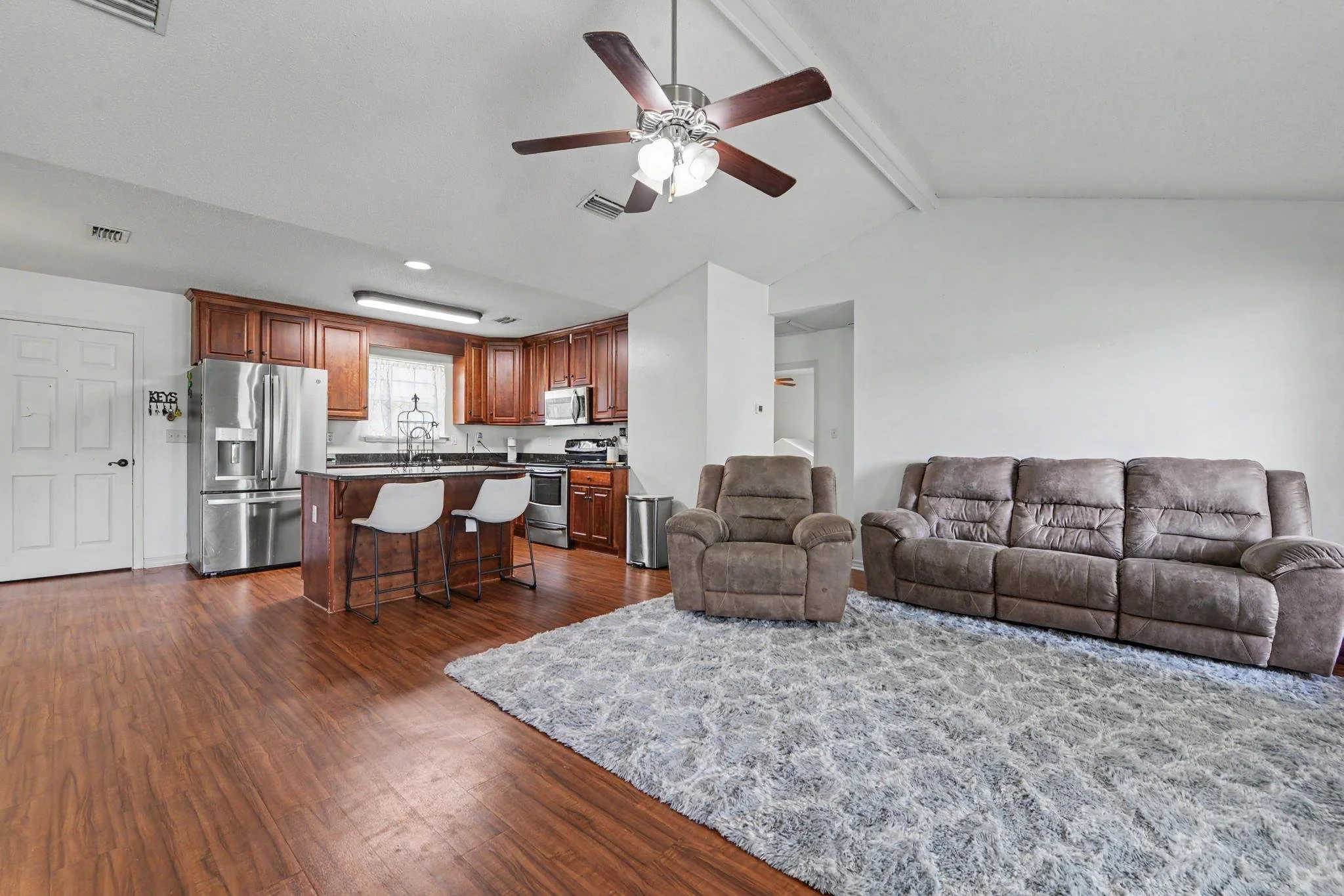 home located in lucedale, ms with 4 acres and three bedrooms and two baths with an enclosed pool cover over the in-ground pool with a workshop