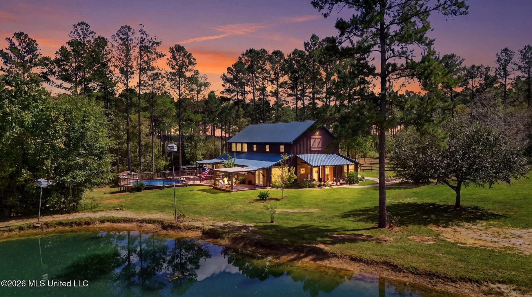 barndominium 26 acres in vancleave mississippi 7 bedrooms 6 bathrooms and 3719 square feet with 26.01 acres in jackson county mississippi with a separate living quarters upstairs and a 2 bedroo 1 bathroom cottage and stocked pond