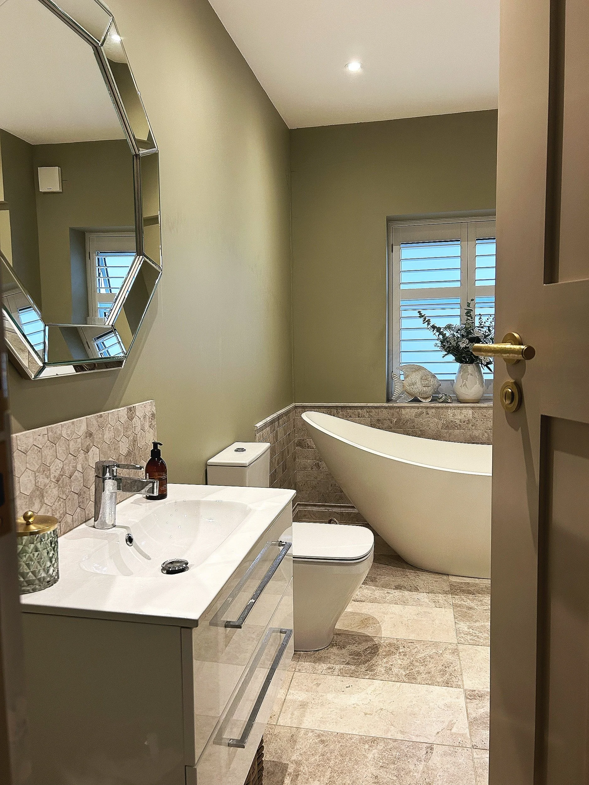 A new bathroom installation showing completed plumbing, tiling and fixtures in a property in Essex.