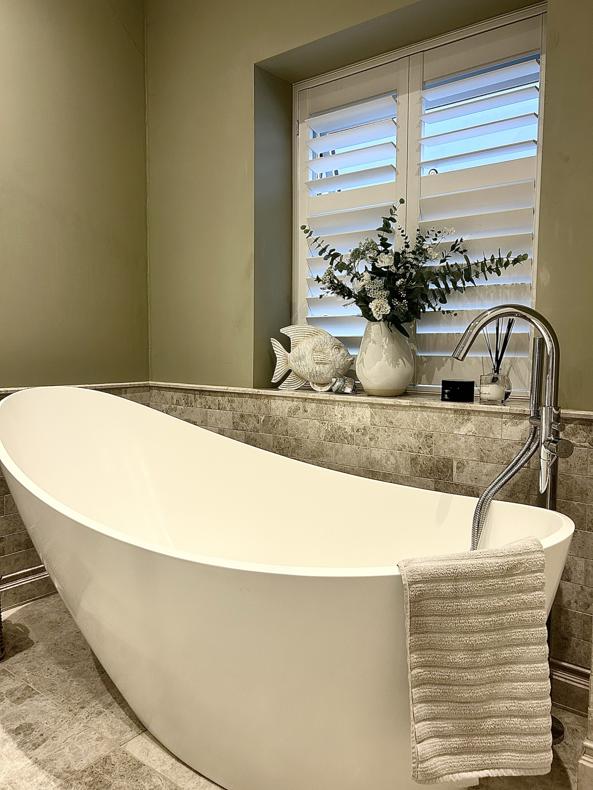 A newly finished bathroom showing modern design, quality tiling and professional renovation work carried out in Essex.