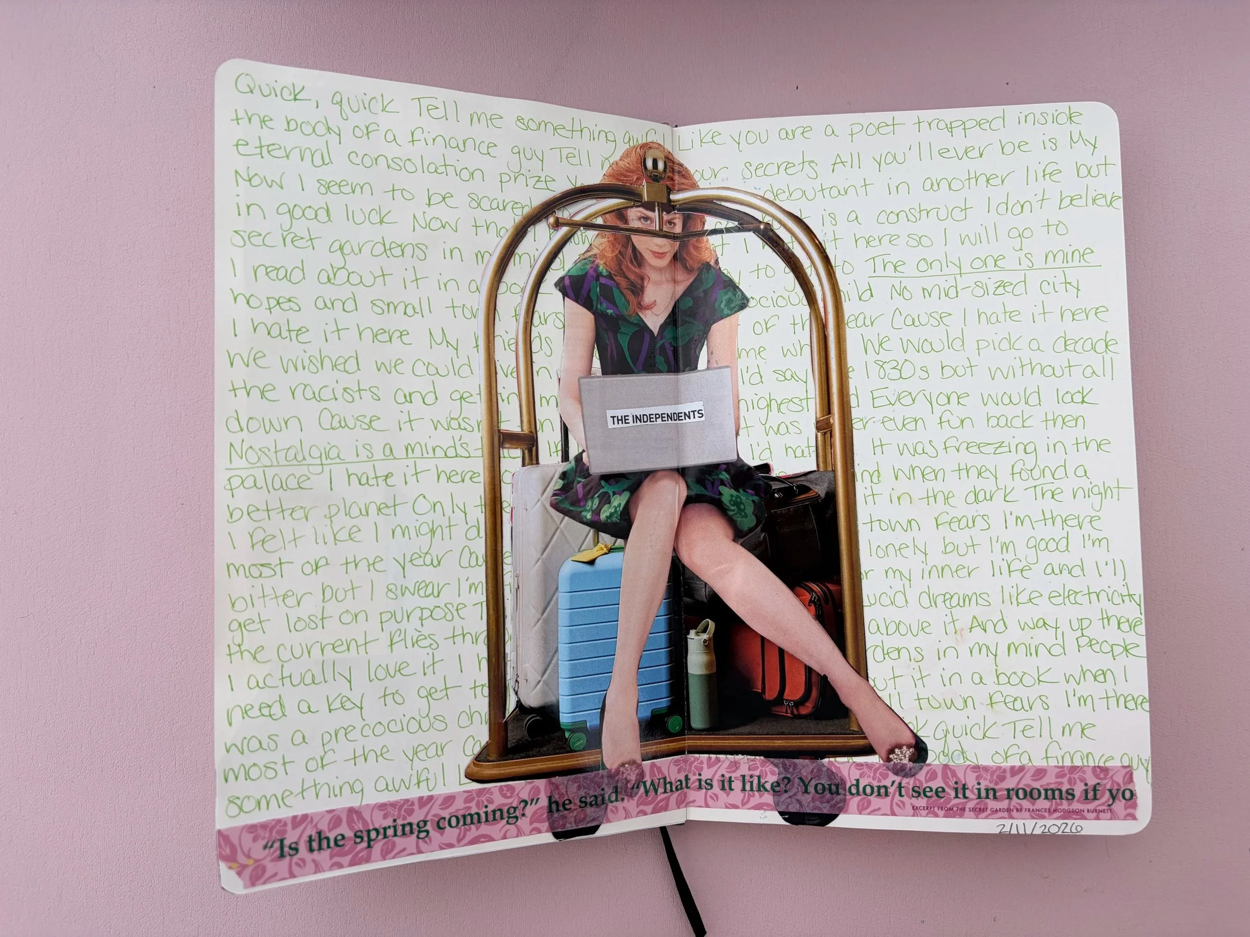 A handwritten journal with green ink on pink background, inside a metal frame with a woman sitting on top holding a laptop with "The Independents" written on it, and suitcases and water bottle at her feet. There is a quote at the bottom that reads, "