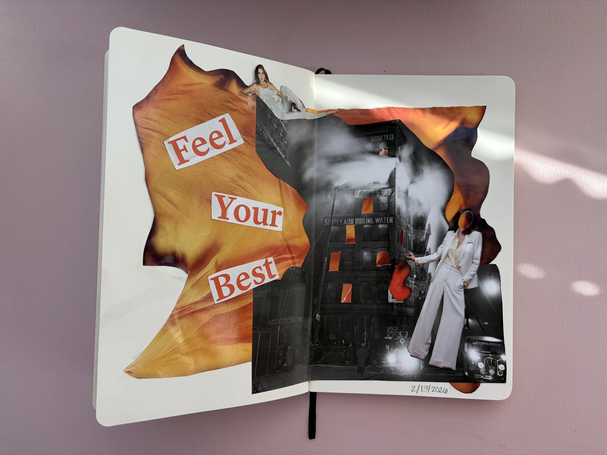 A collage art journal page with a torn fiery orange paper background and black and white photos of a burning building and a woman in a white suit. The words "Feel Your Best" are cut out from red and white paper and placed on the page. The date "2/13/