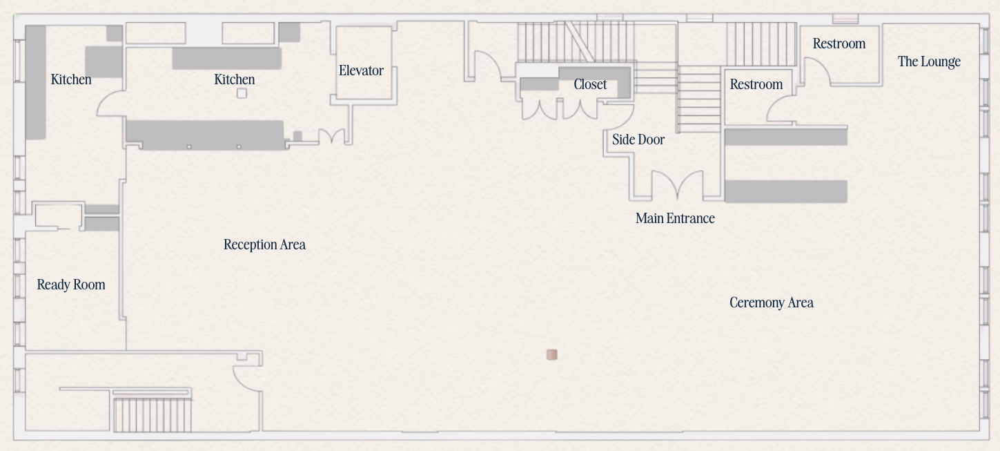 Floor plan of a building showing rooms labeled as Kitchen, Ready Room, Reception Area, Main Entrance, Ceremony Area, Restroom, The Lounge, Closet, and Elevator, with staircases and wall partitions.