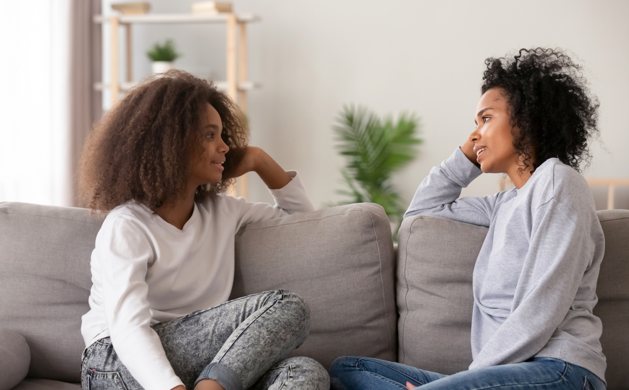 Mother and daughter talking comfortably on a walk