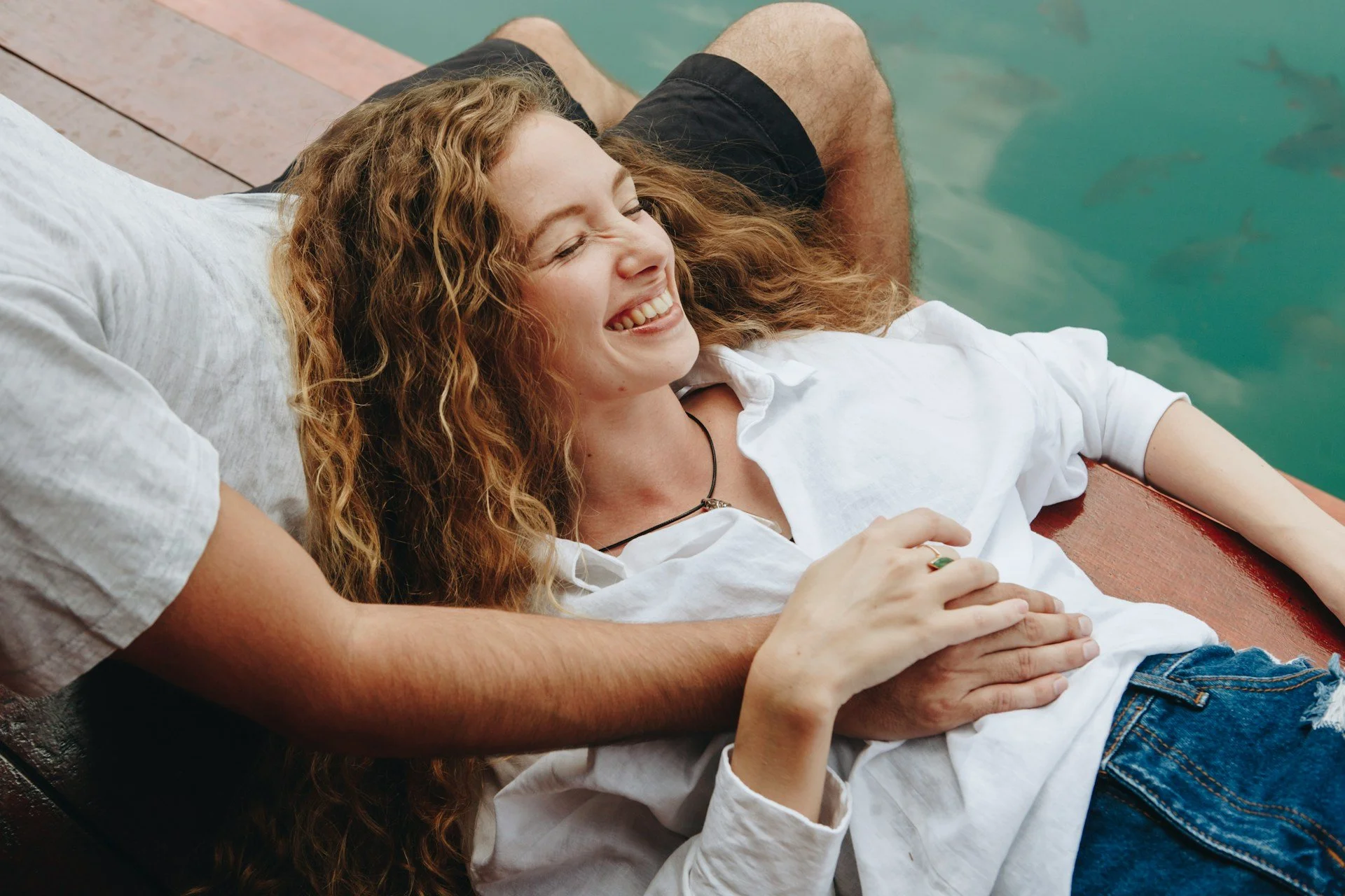 Smiling woman with partner after online marriage counseling in Minnesota