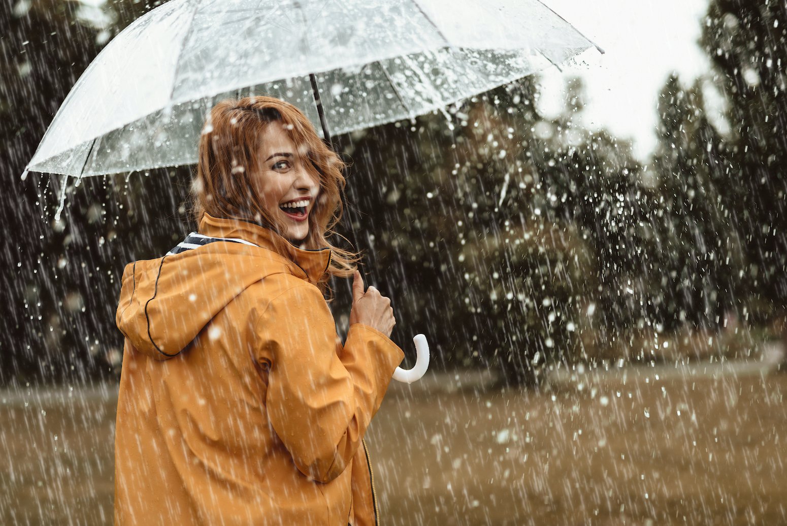 Woman with umbrella in rain after EMDR therapy