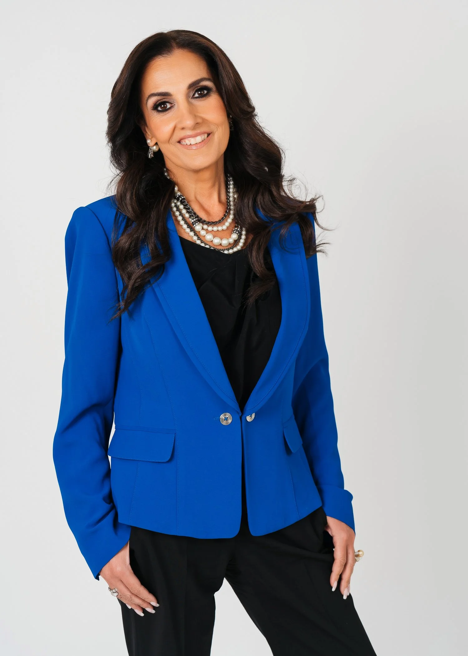Sima-standing-headshot-blue-blazer.jpg