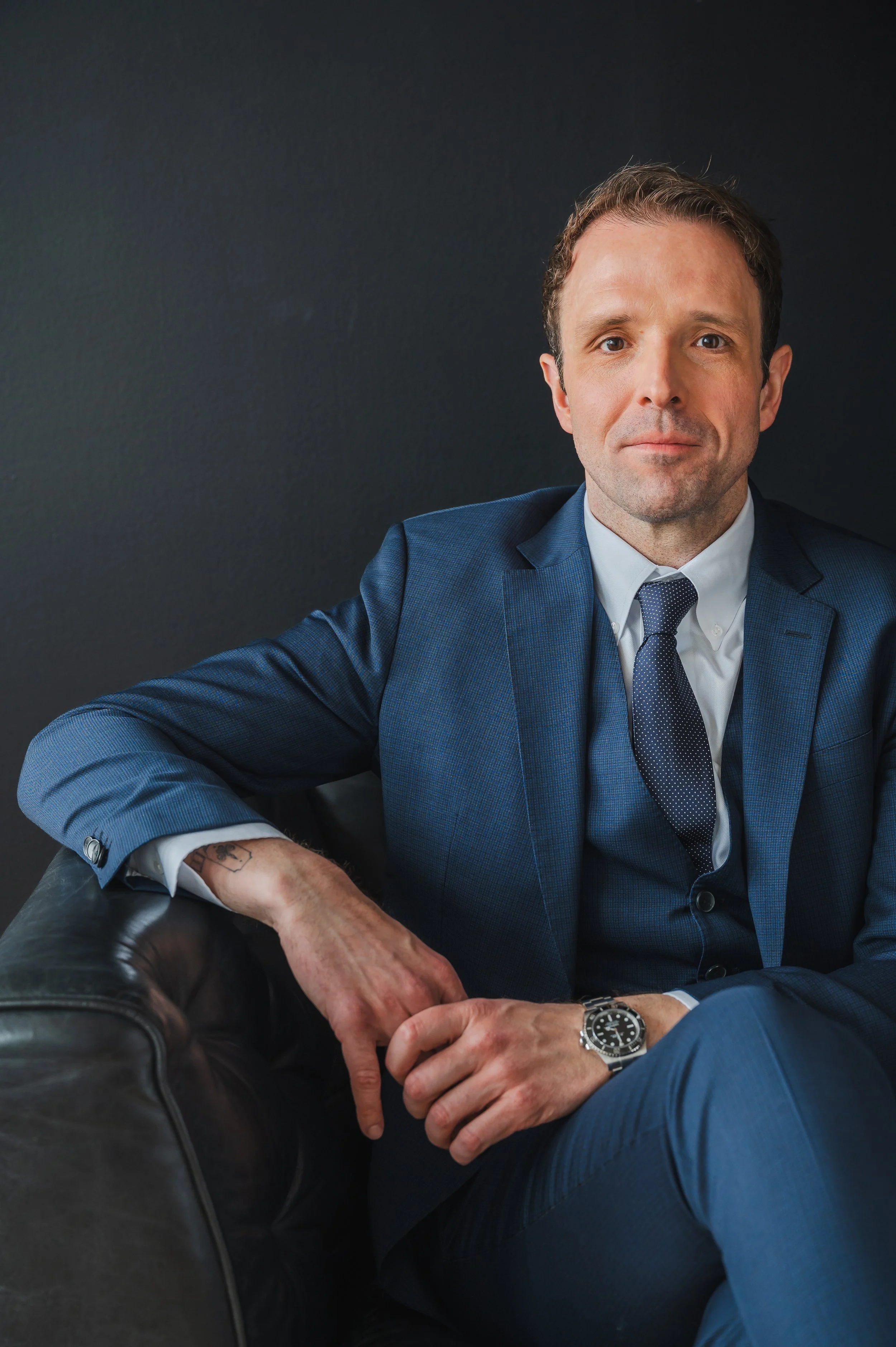 A professional branding portrait of a general counsel in a suit