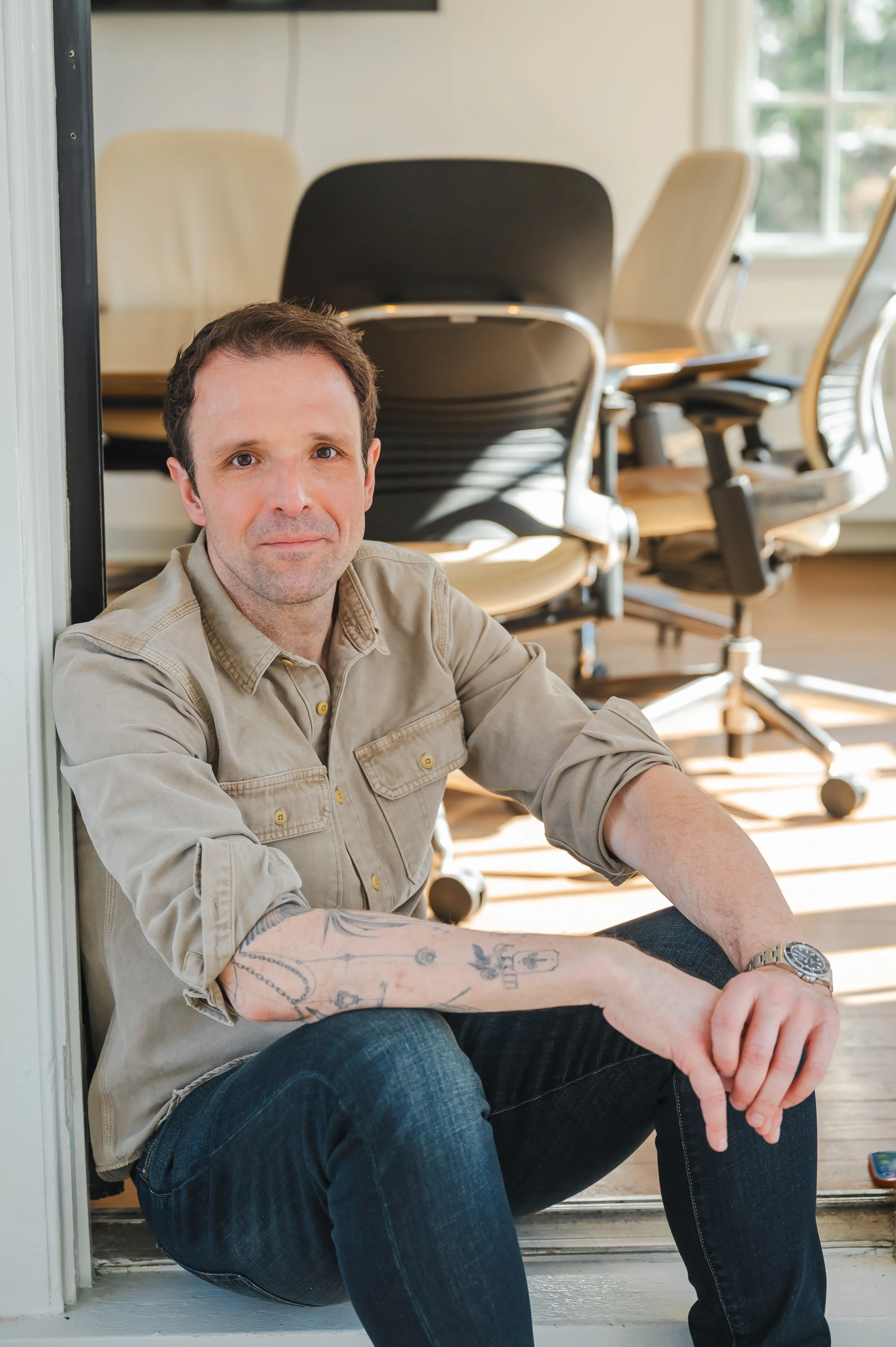 A casual branding photo of a general counsel outside of a conference room