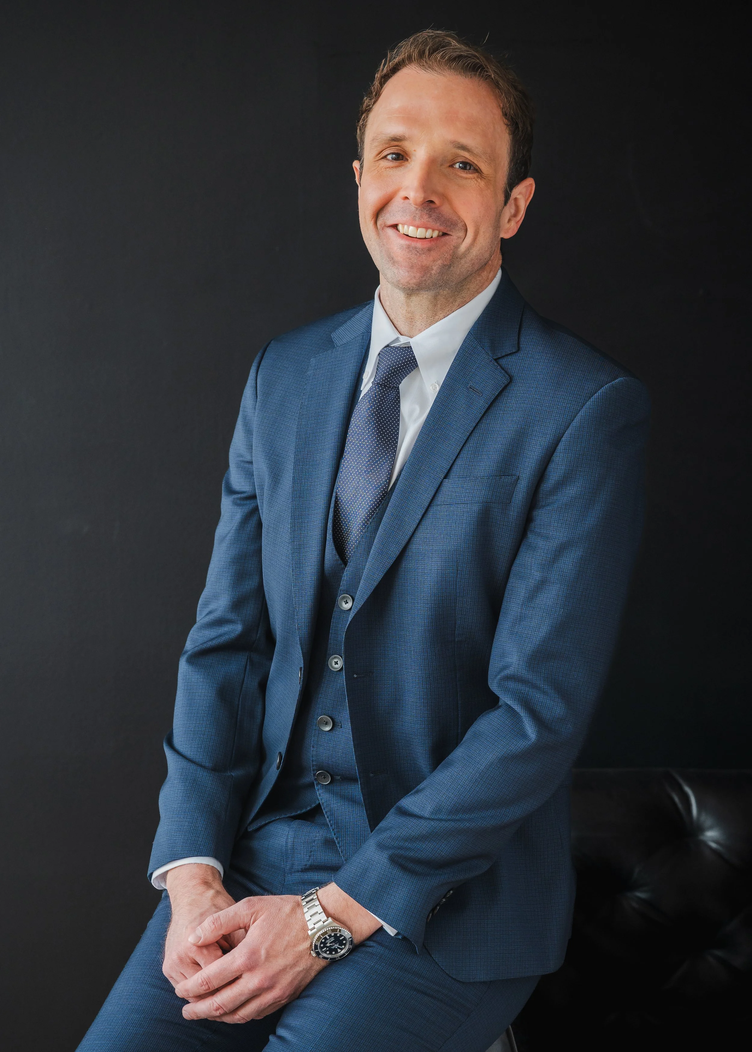 a personal branding headshot of an executive relaxing during his photoshoot